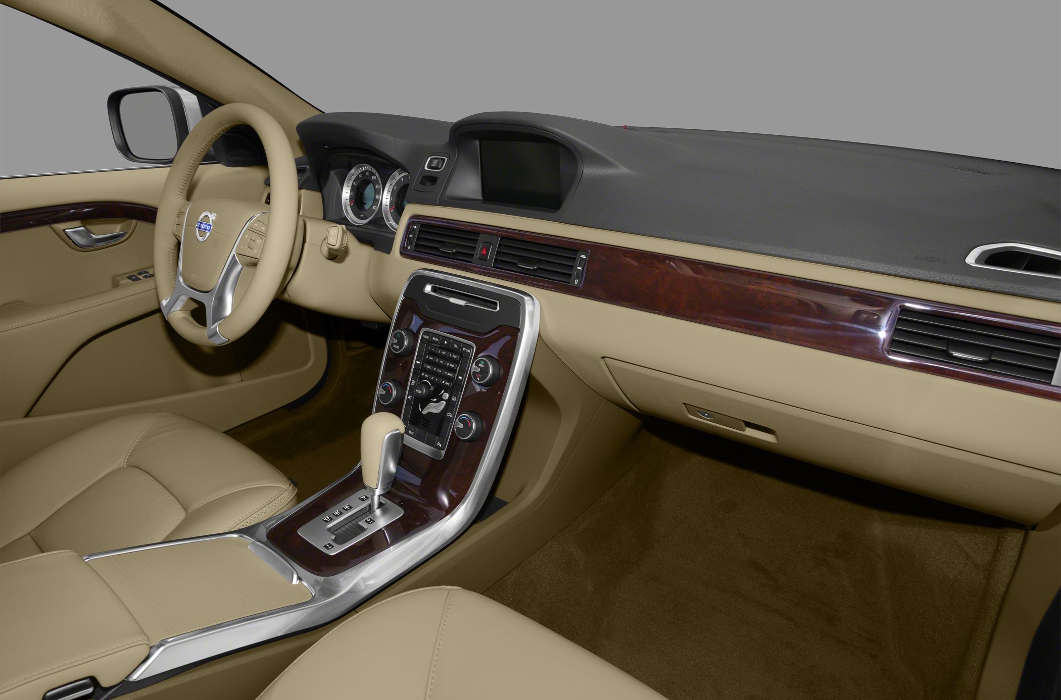 Beige leather interior with wood trim dashboard and automatic gear shift