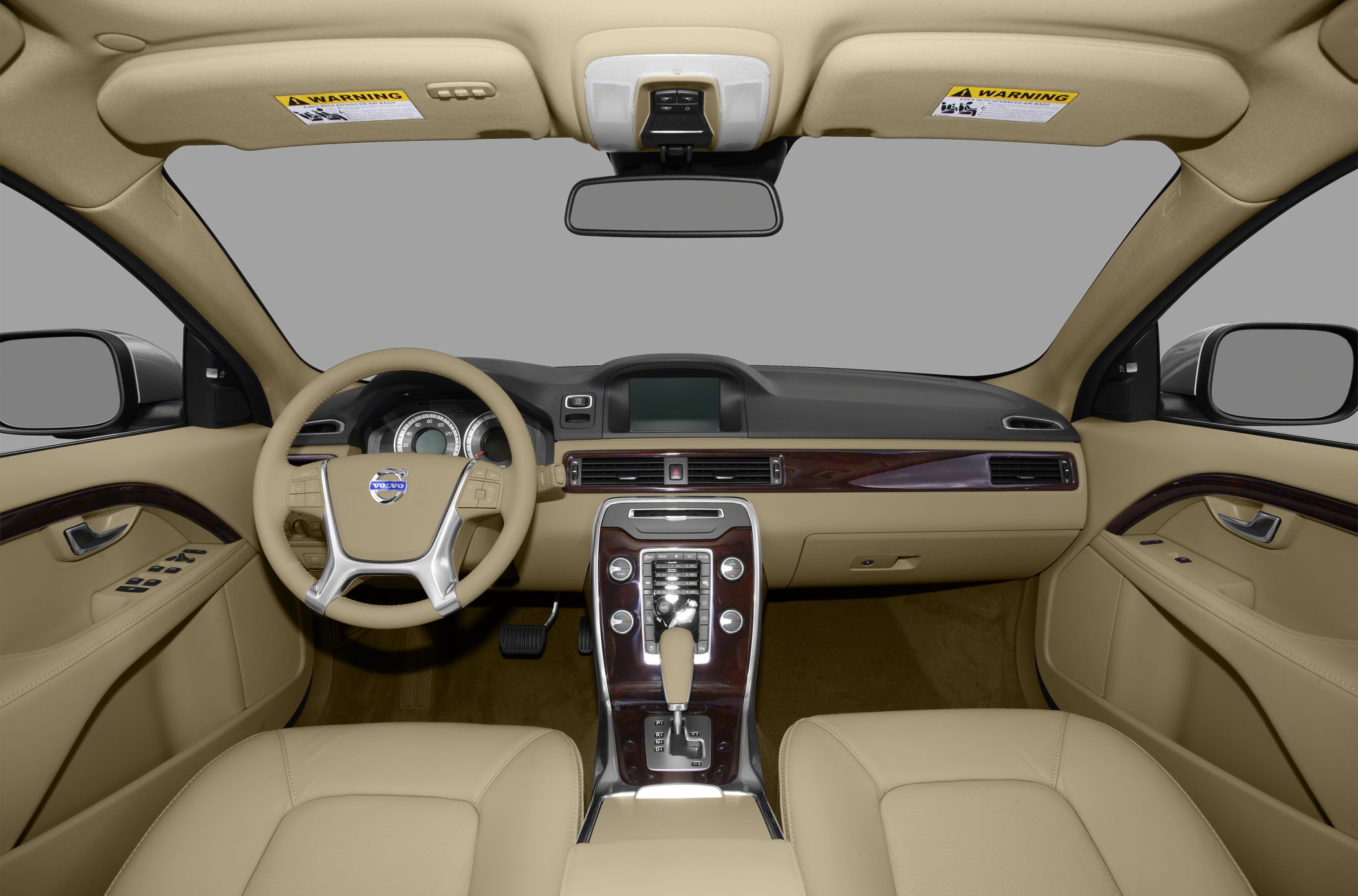 Beige dashboard and steering wheel with wood trim and central console