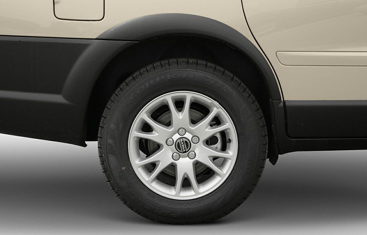 Silver alloy wheel with Pirelli Scorpion tire on vehicle rear side