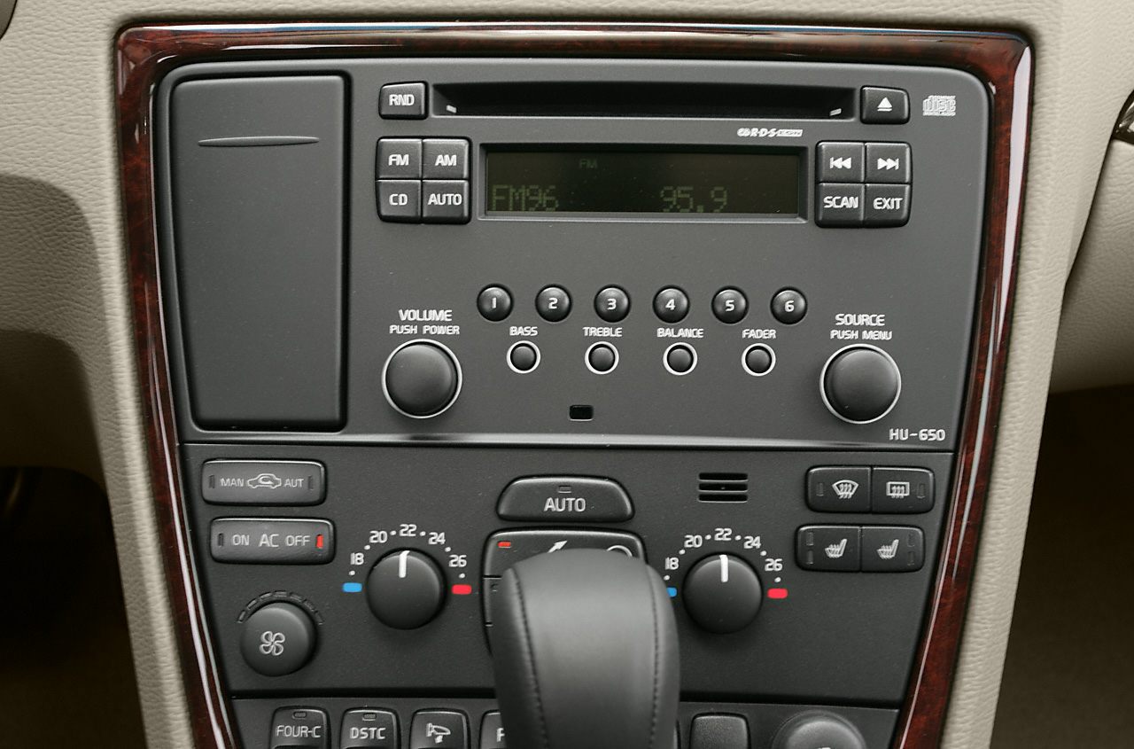 Car radio and climate control panel with buttons and knobs