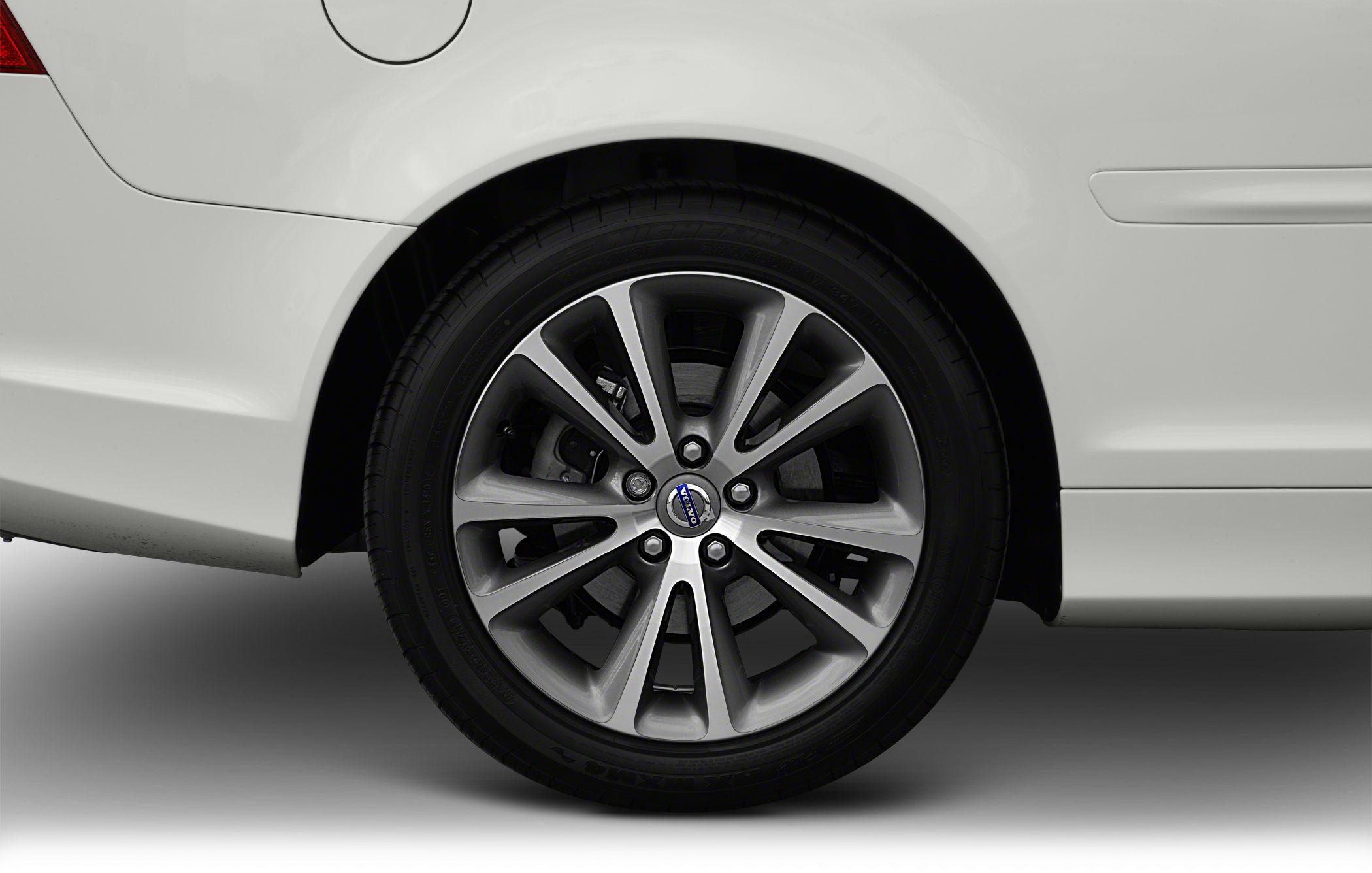 Close-up of alloy wheel and tire on a car’s rear side.