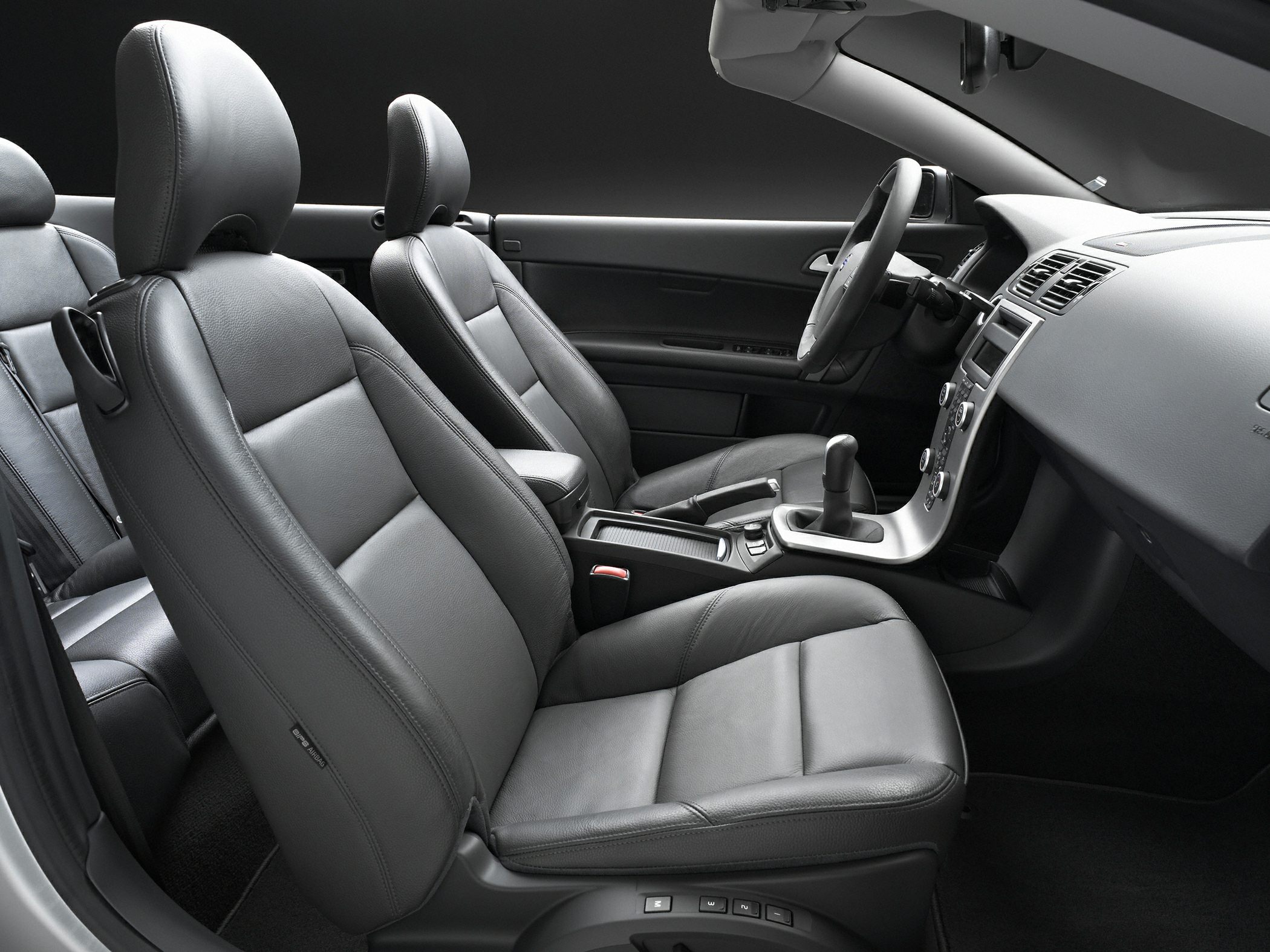 Black leather seats and modern dashboard with gear shift