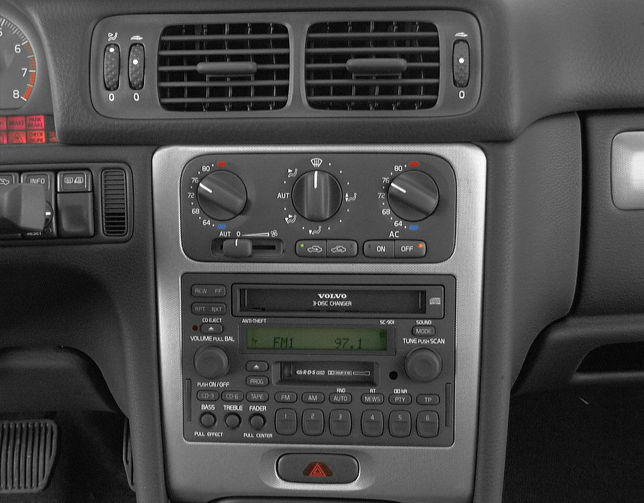 Dashboard stereo system and dual-zone climate controls with vents and buttons