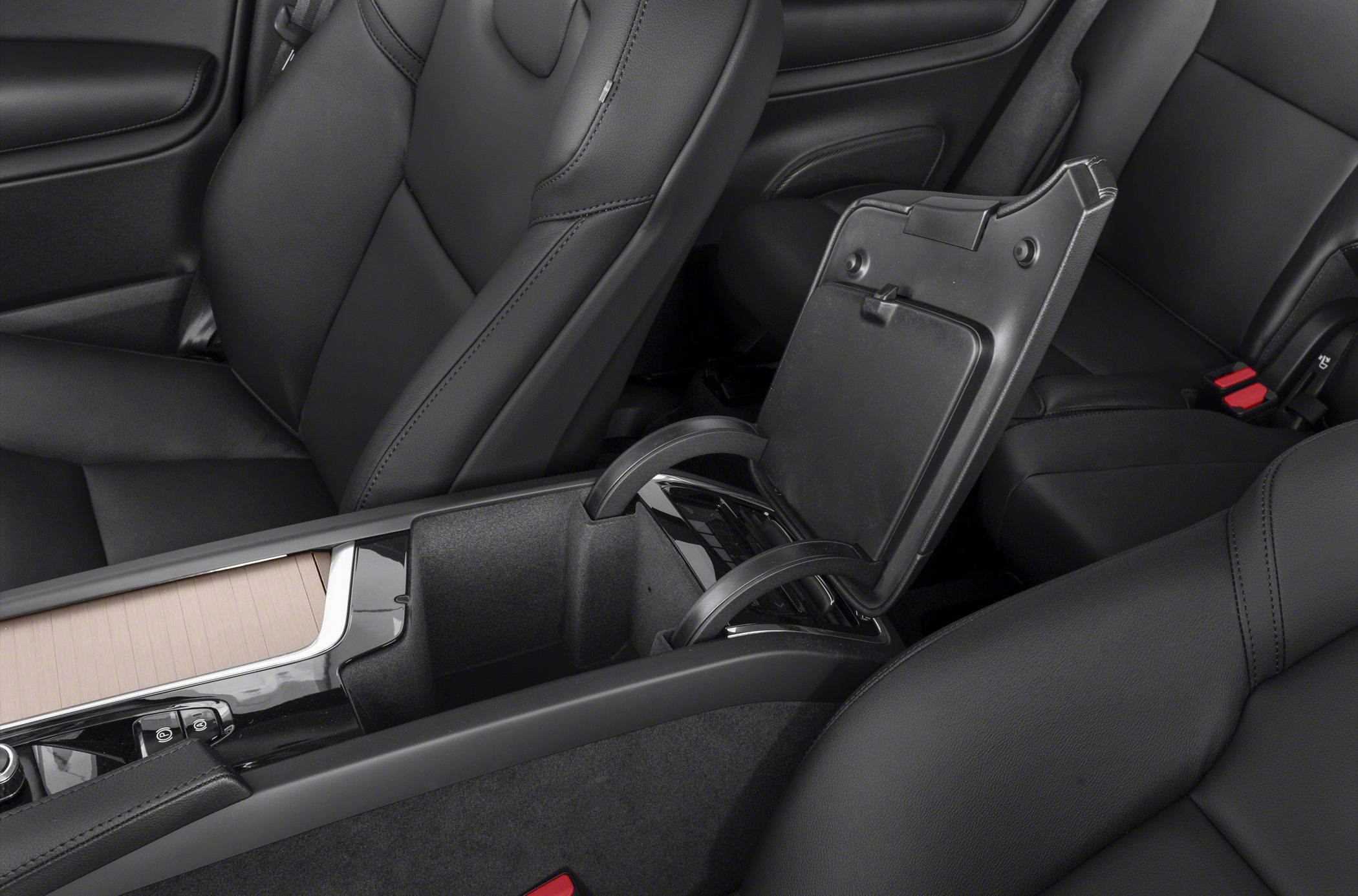 Center console storage compartment with black leather seats interior