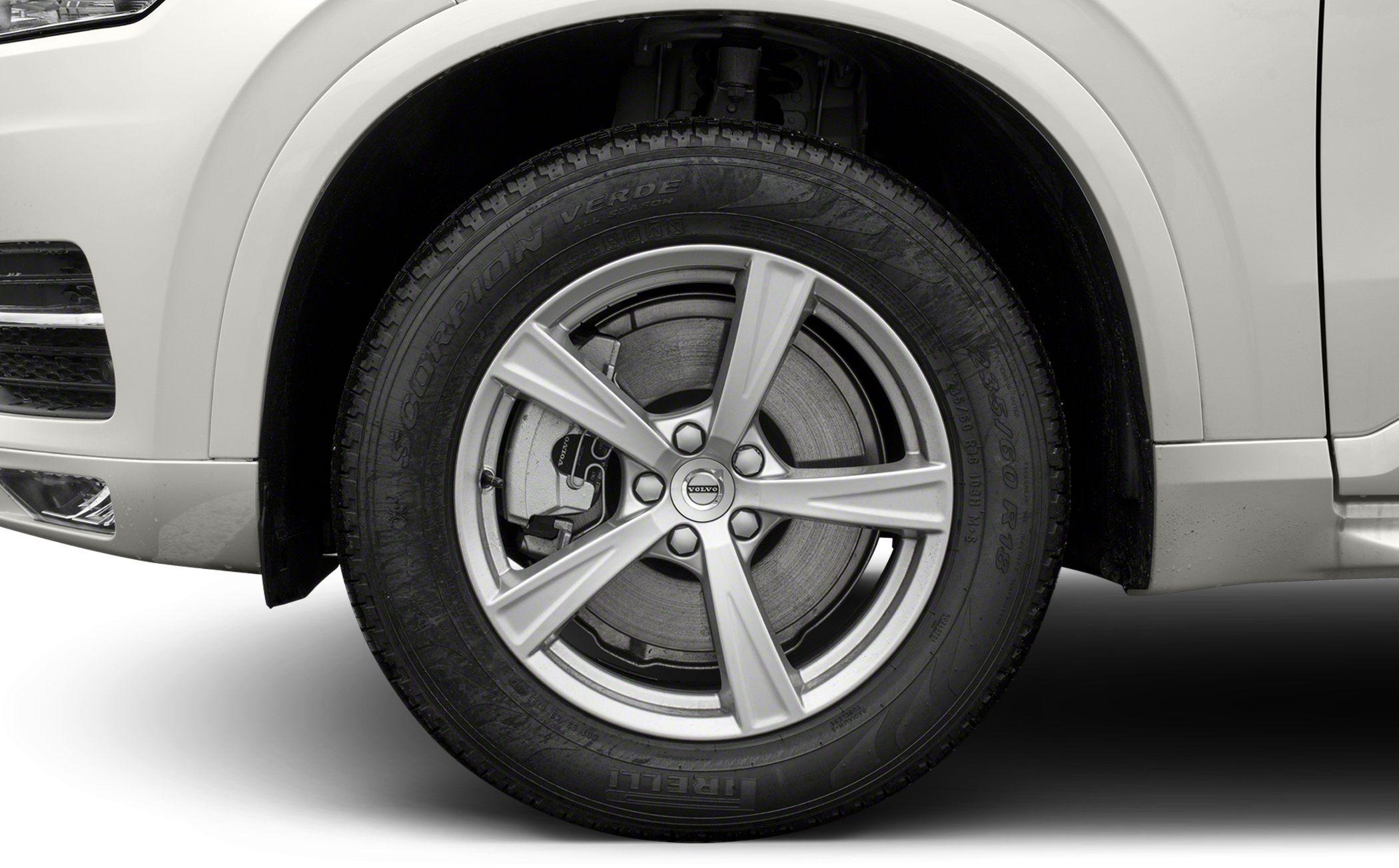 Close-up of alloy wheel with brake disc and caliper on tire