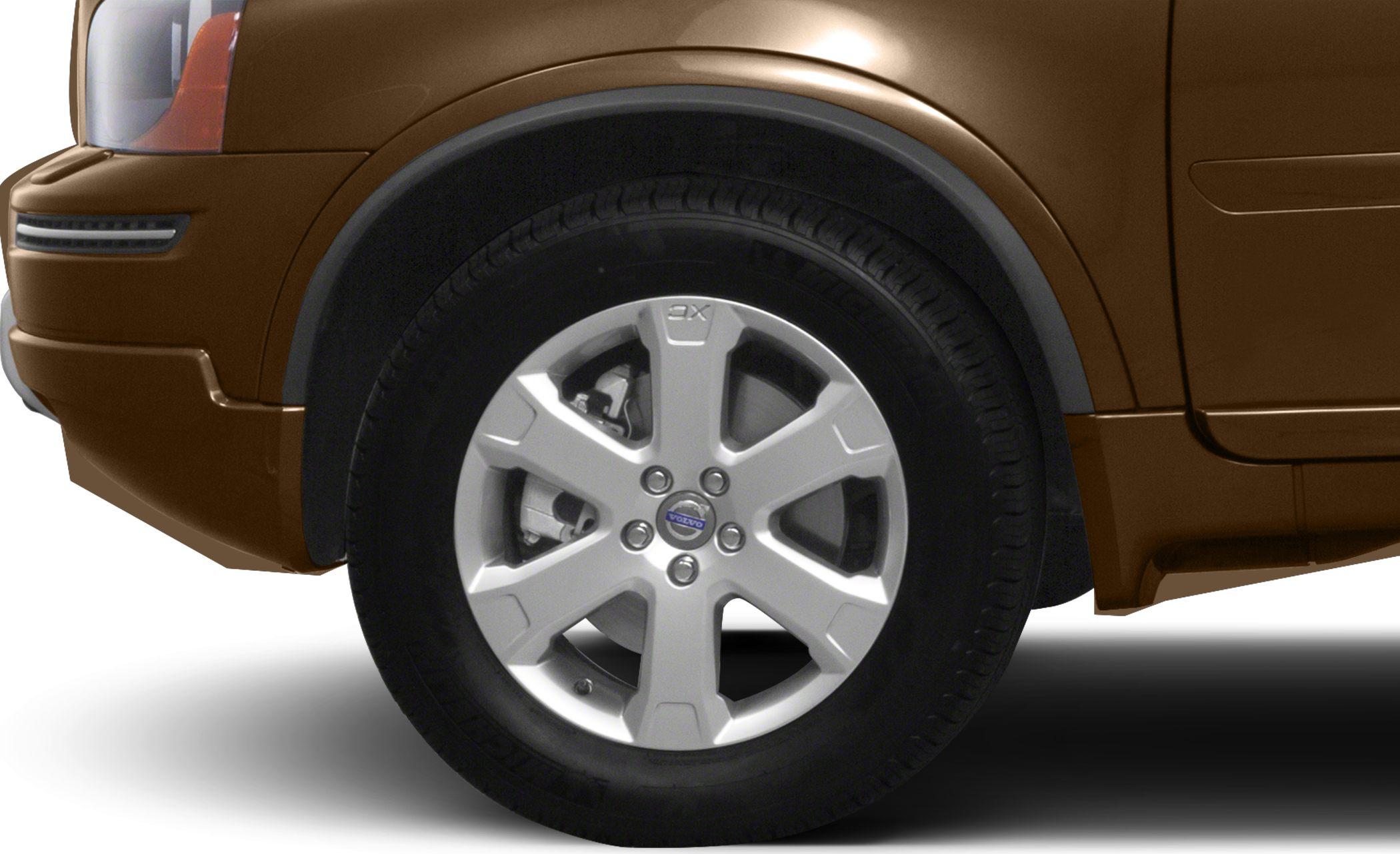 Close-up of alloy wheel and tire on an SUV's front fender.