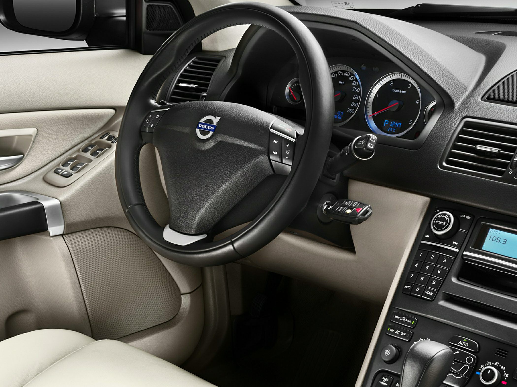 Steering wheel and instrument cluster with center console controls