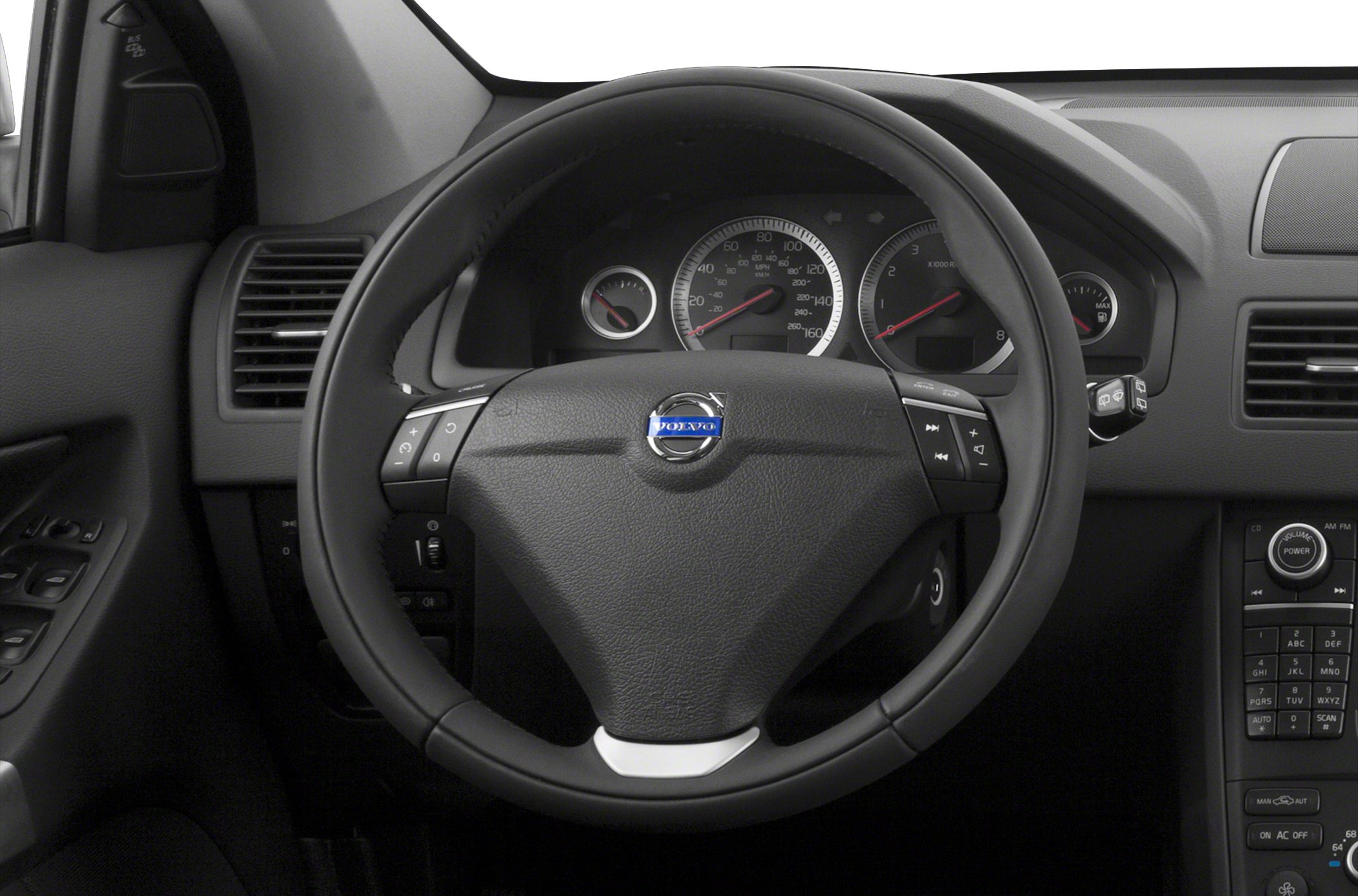 Steering wheel and instrument cluster with dashboard controls.