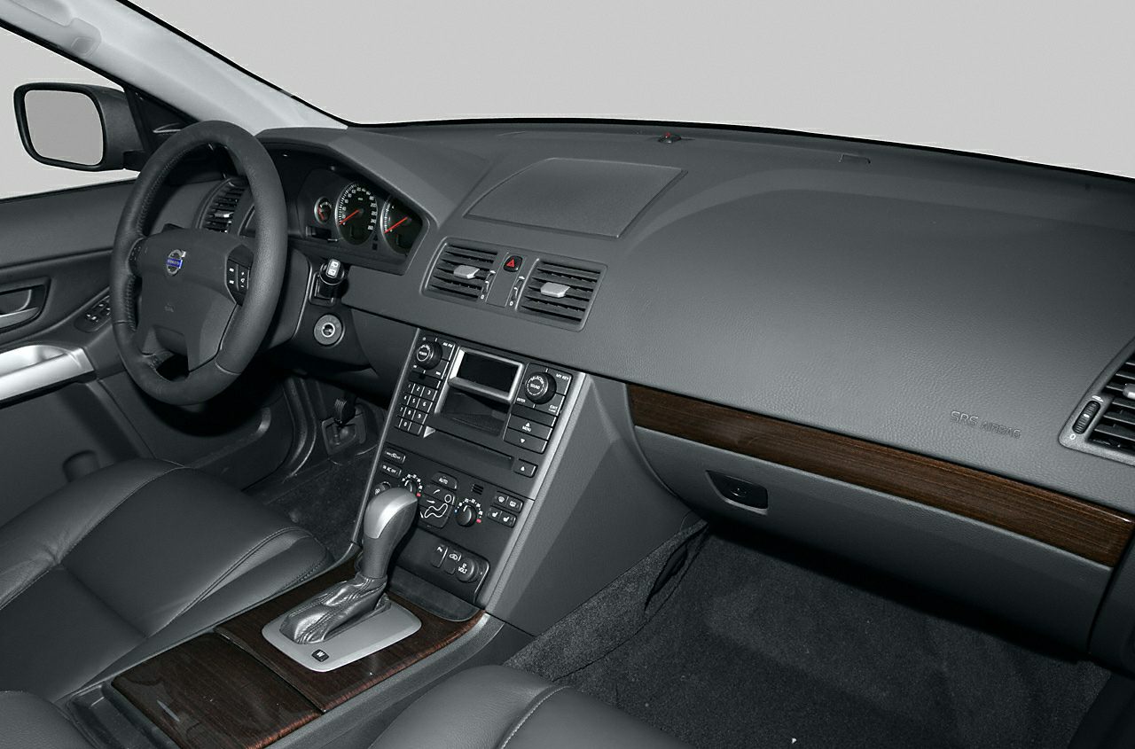 Dashboard with wood trim and steering wheel from a 2003 SUV interior
