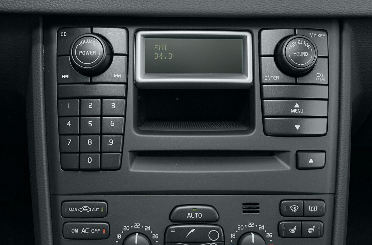 Classic radio and climate control panel with digital FM display