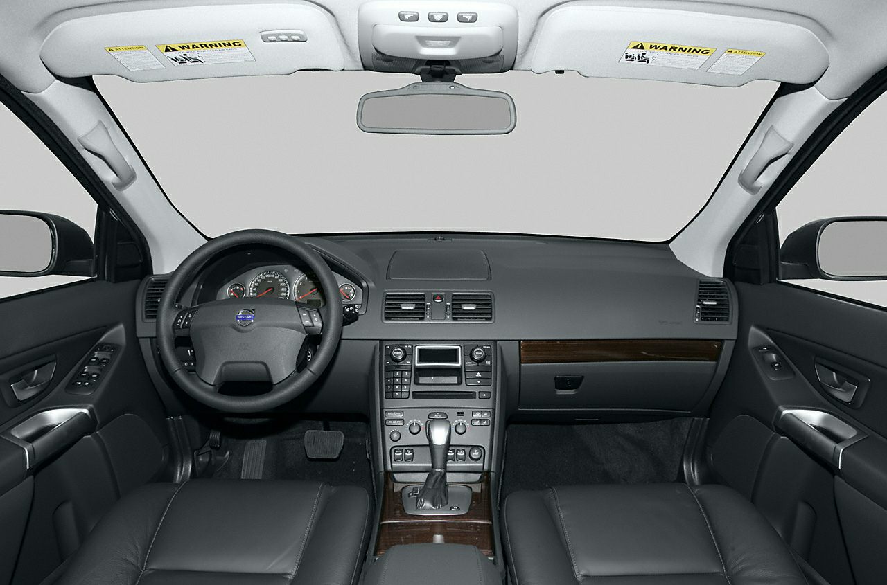 Black leather interior featuring steering wheel and dashboard with center console