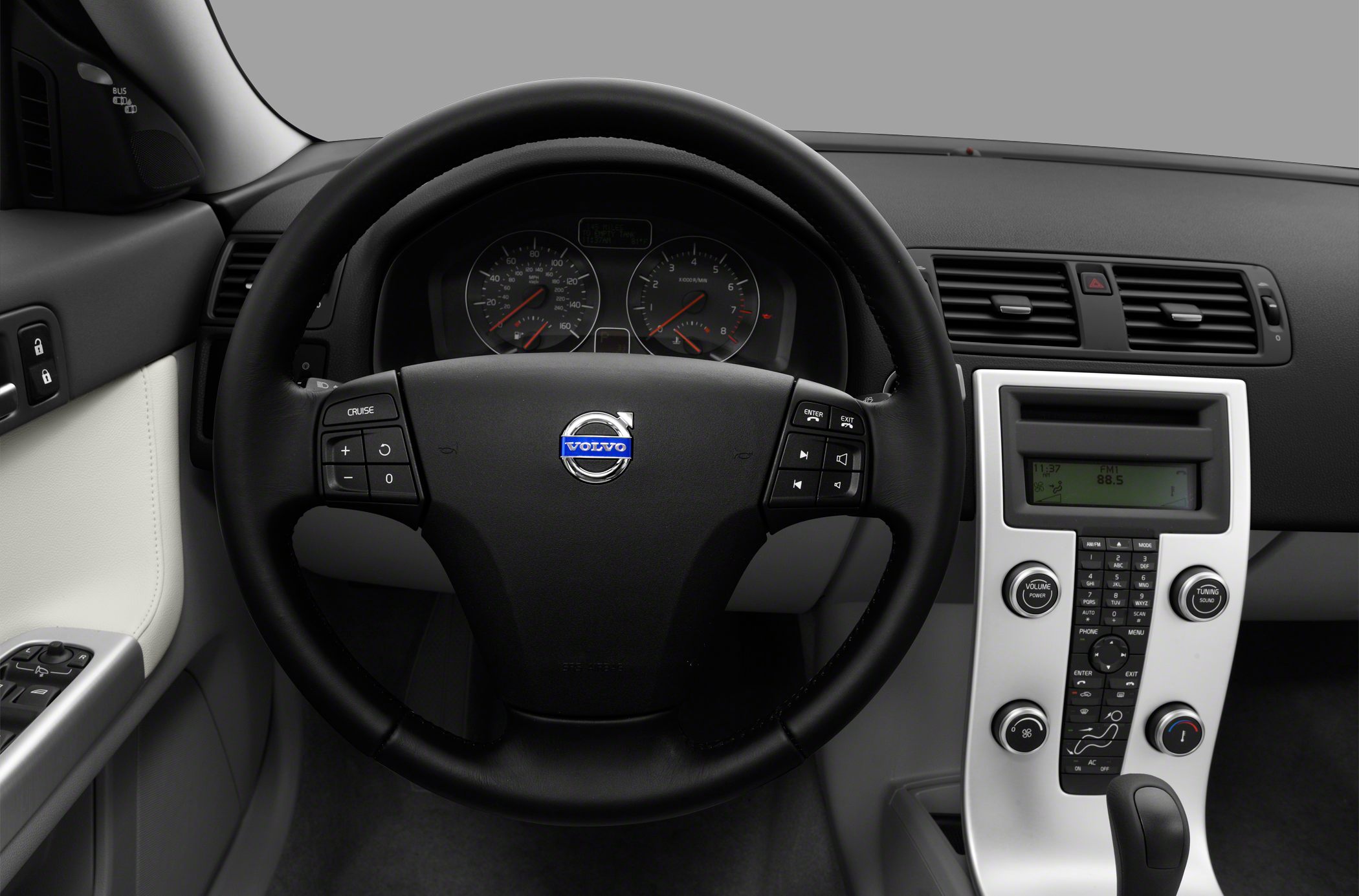 Steering wheel with cruise and audio controls, center console with climate and audio functions
