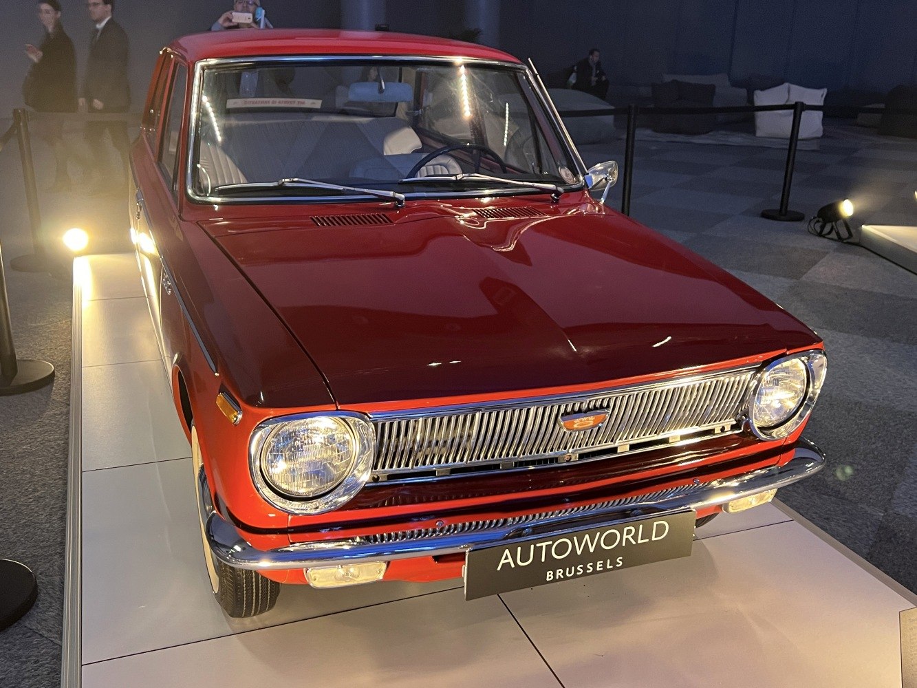 Front view with chrome grille and round headlights