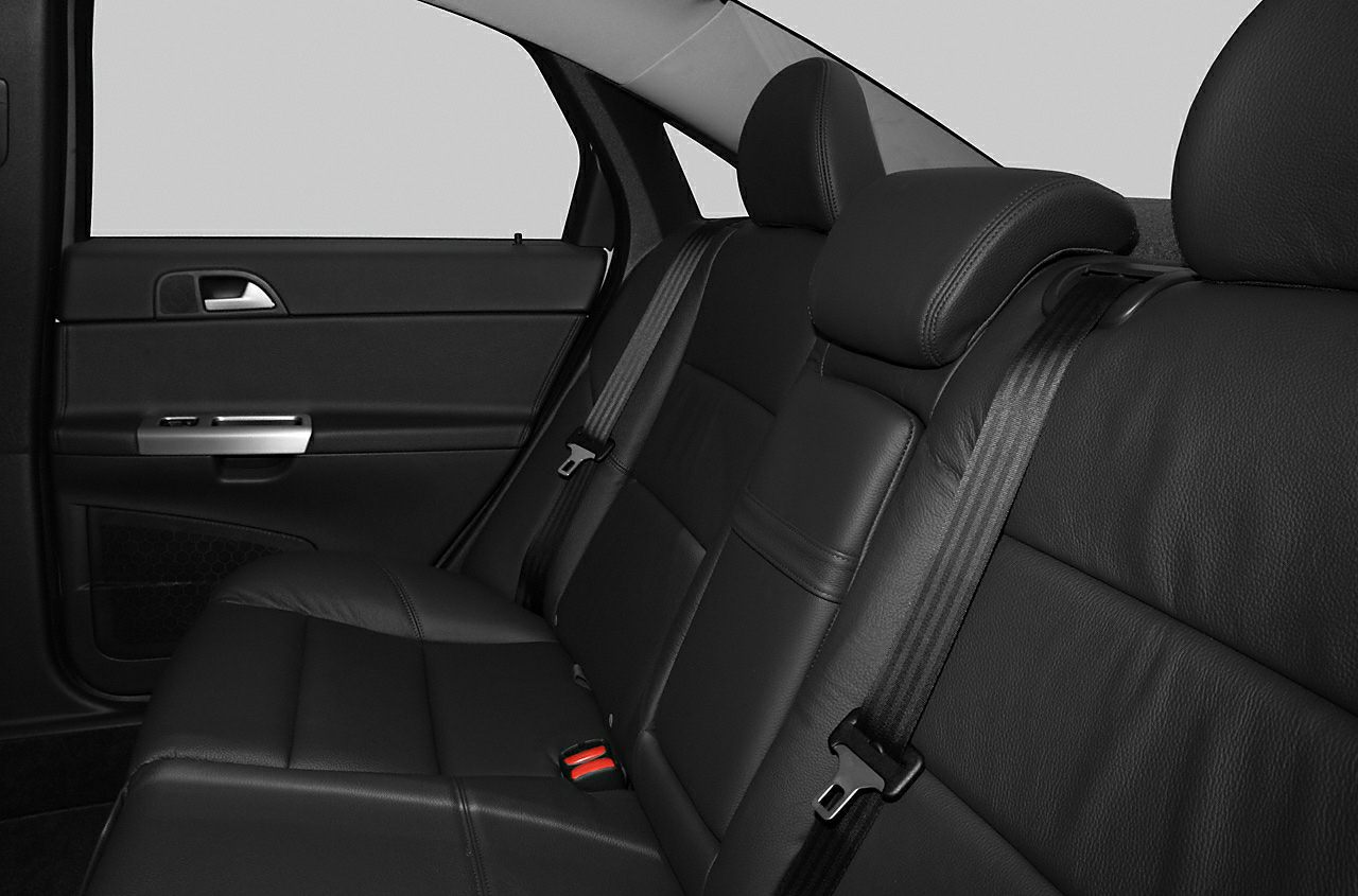 Black leather rear seat with headrests and seat belts