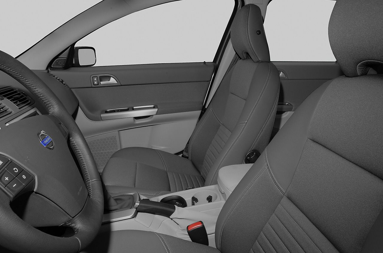 Front seats, steering wheel, dashboard, and center console interior view