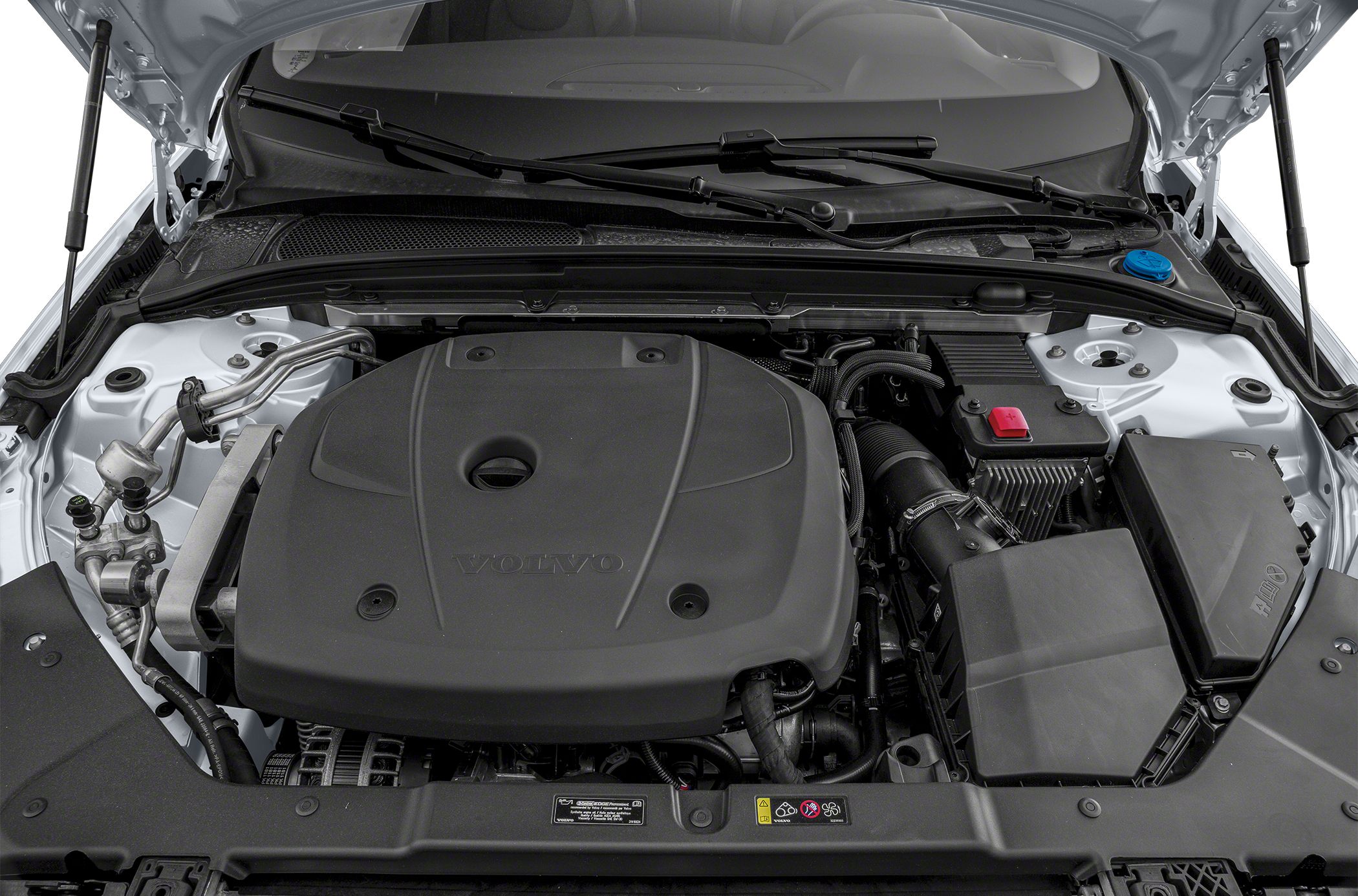 Engine bay with a large plastic engine cover and visible components