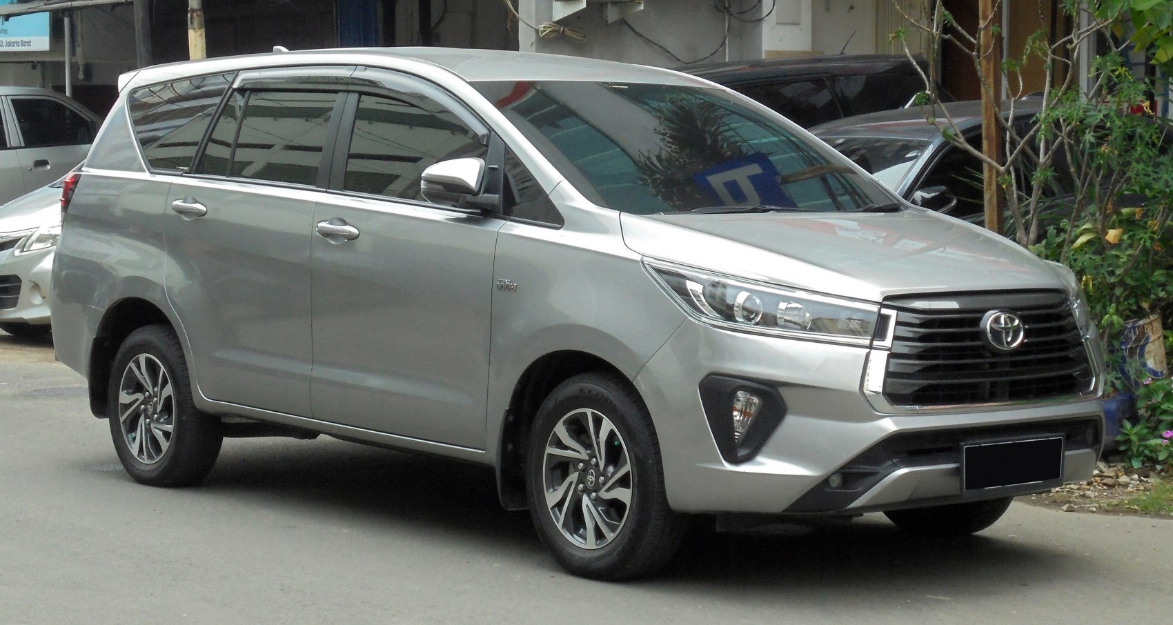 Silver SUV front side view with distinctive headlights and alloy wheels