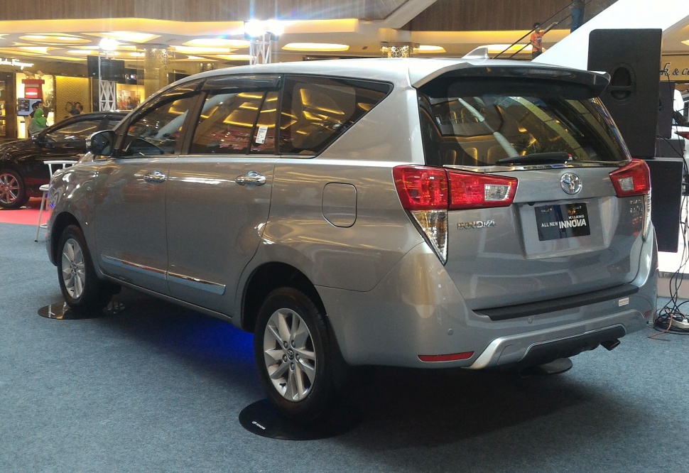 Silver MPV rear view with unique taillights and alloy wheels