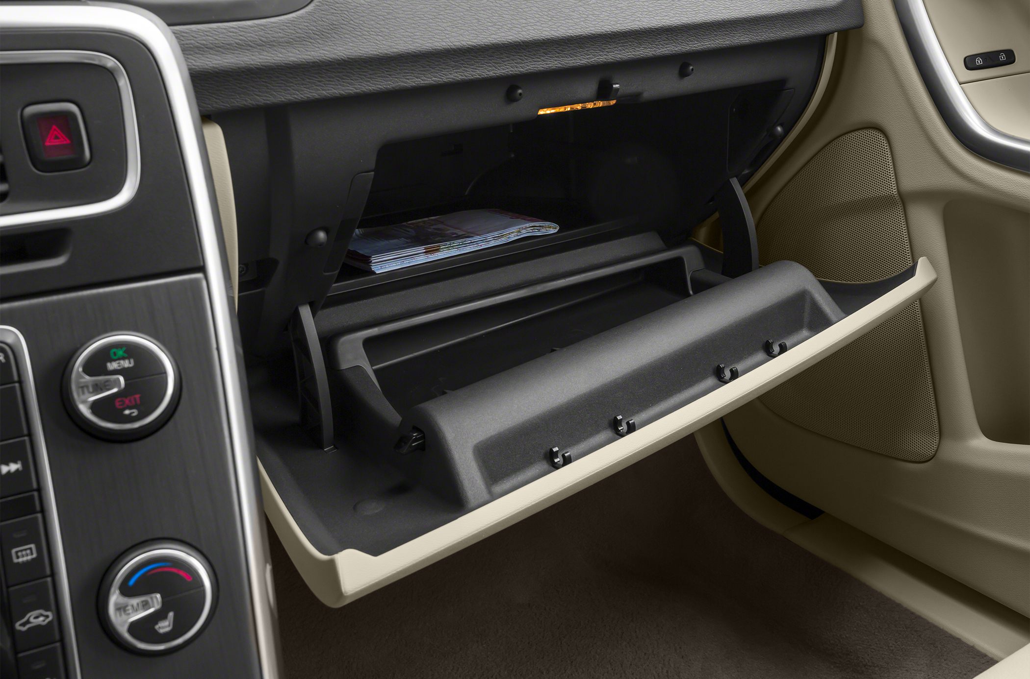 Spacious illuminated glove compartment with storage shelf and dashboard controls