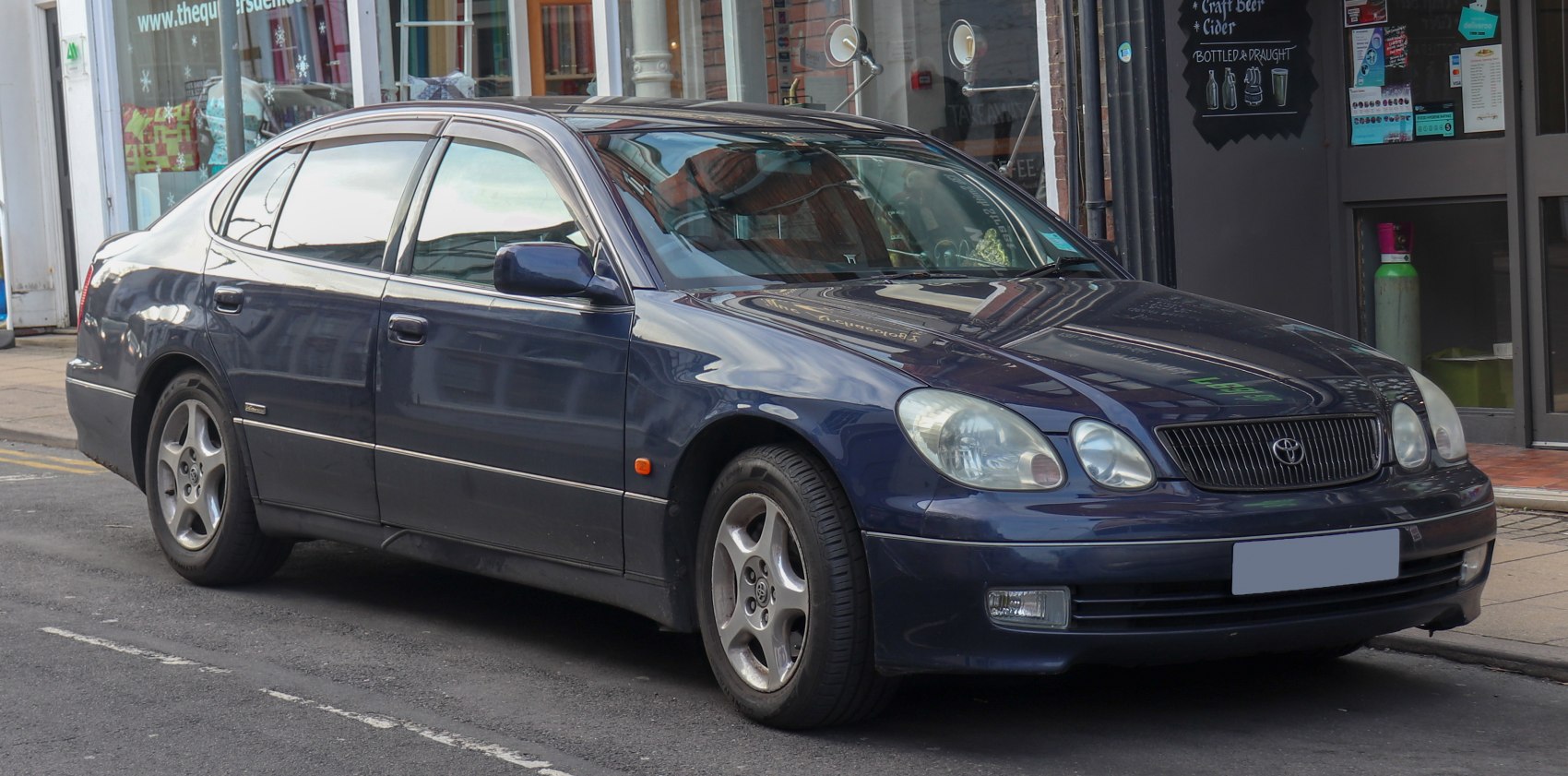 Dual round headlights with classic four-door sedan shape
