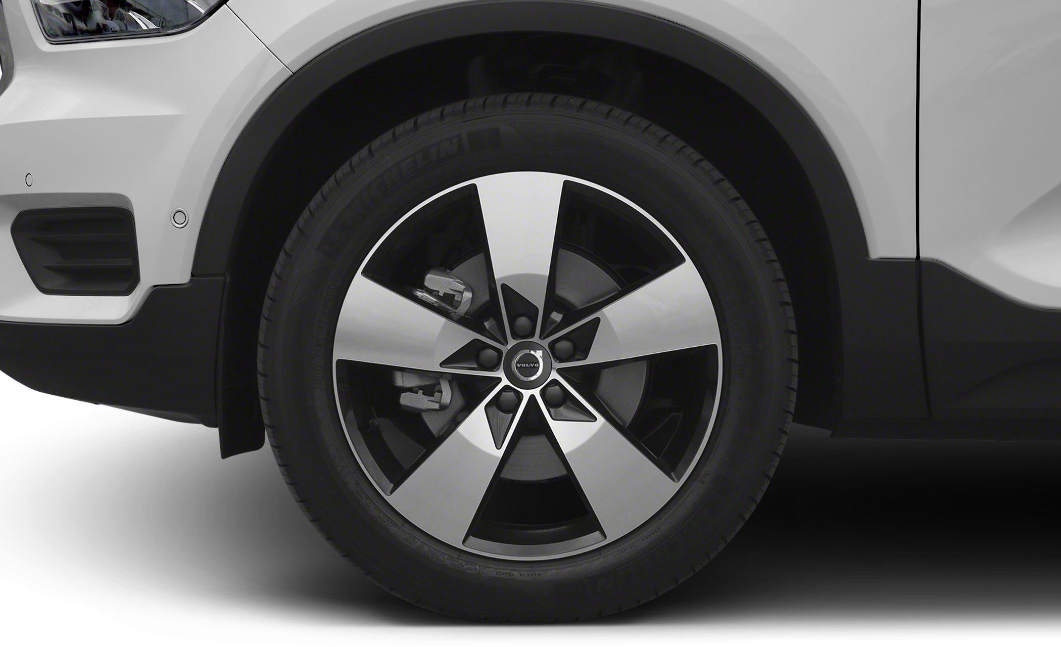 Alloy wheel and tire close-up with brake disc and parking sensors