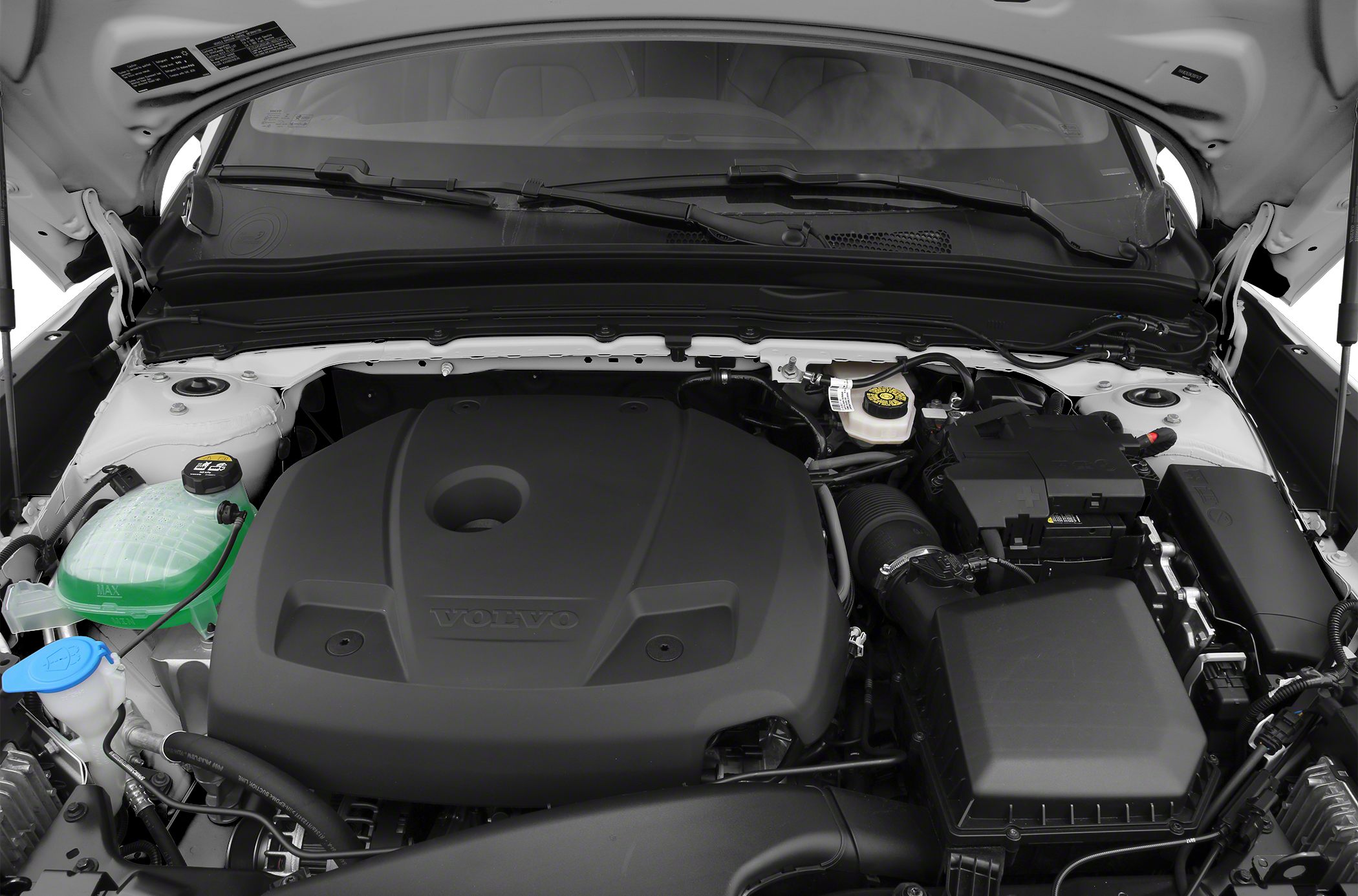 Engine bay with Volvo-branded engine cover and surrounding components