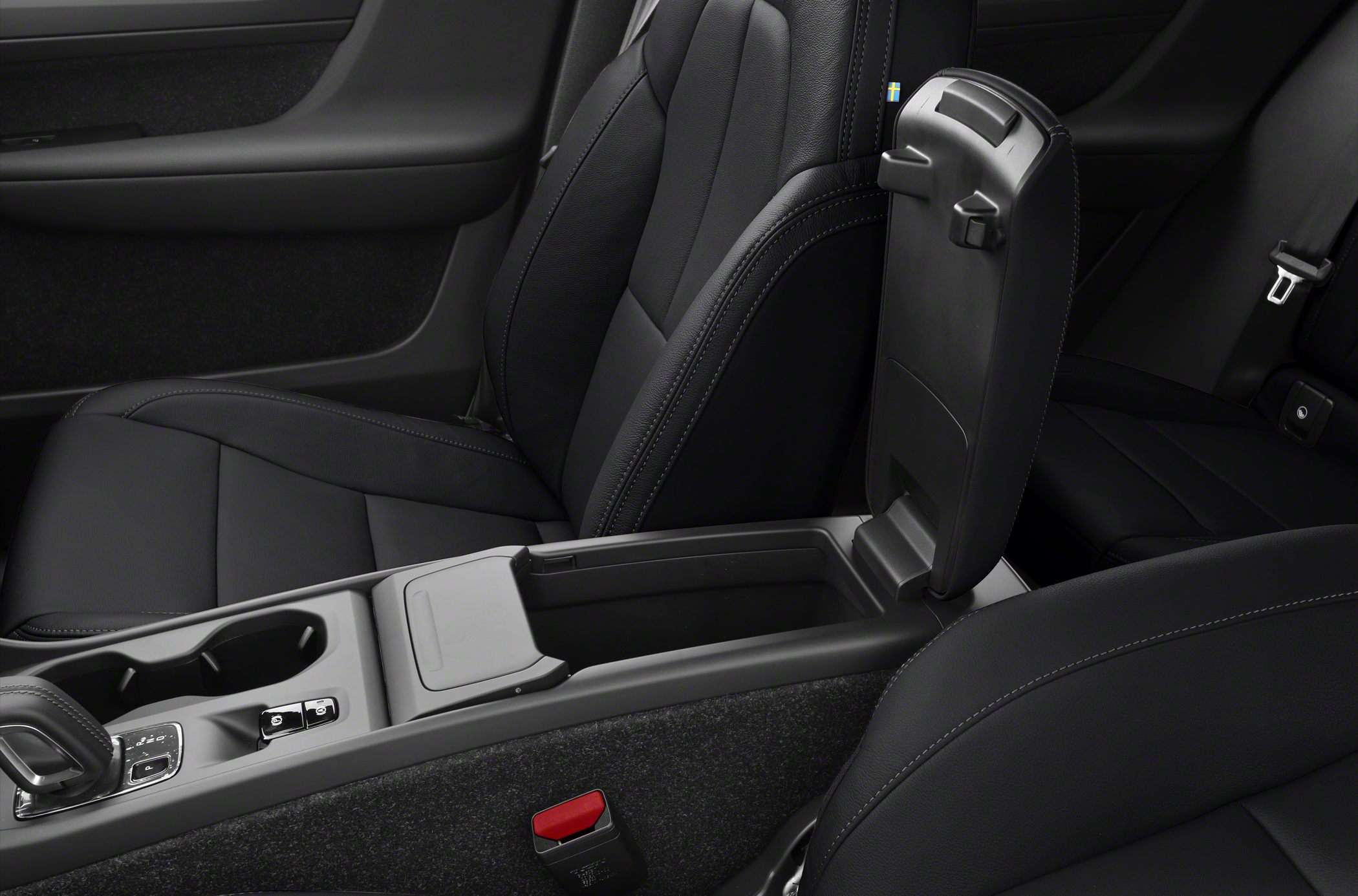 Black leather seats with open armrest storage compartment in center console