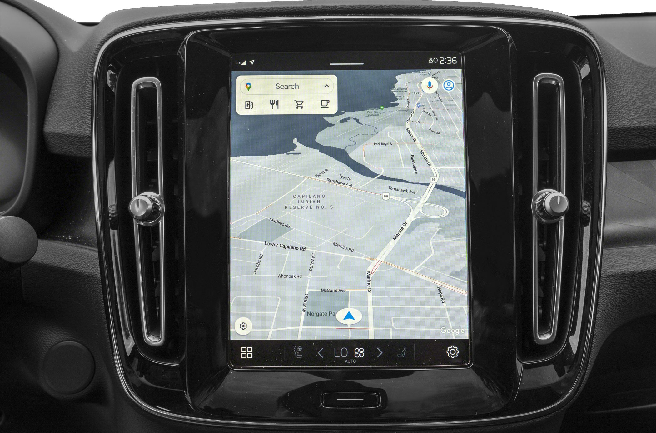 Touchscreen navigation and infotainment system display with map view and control icons