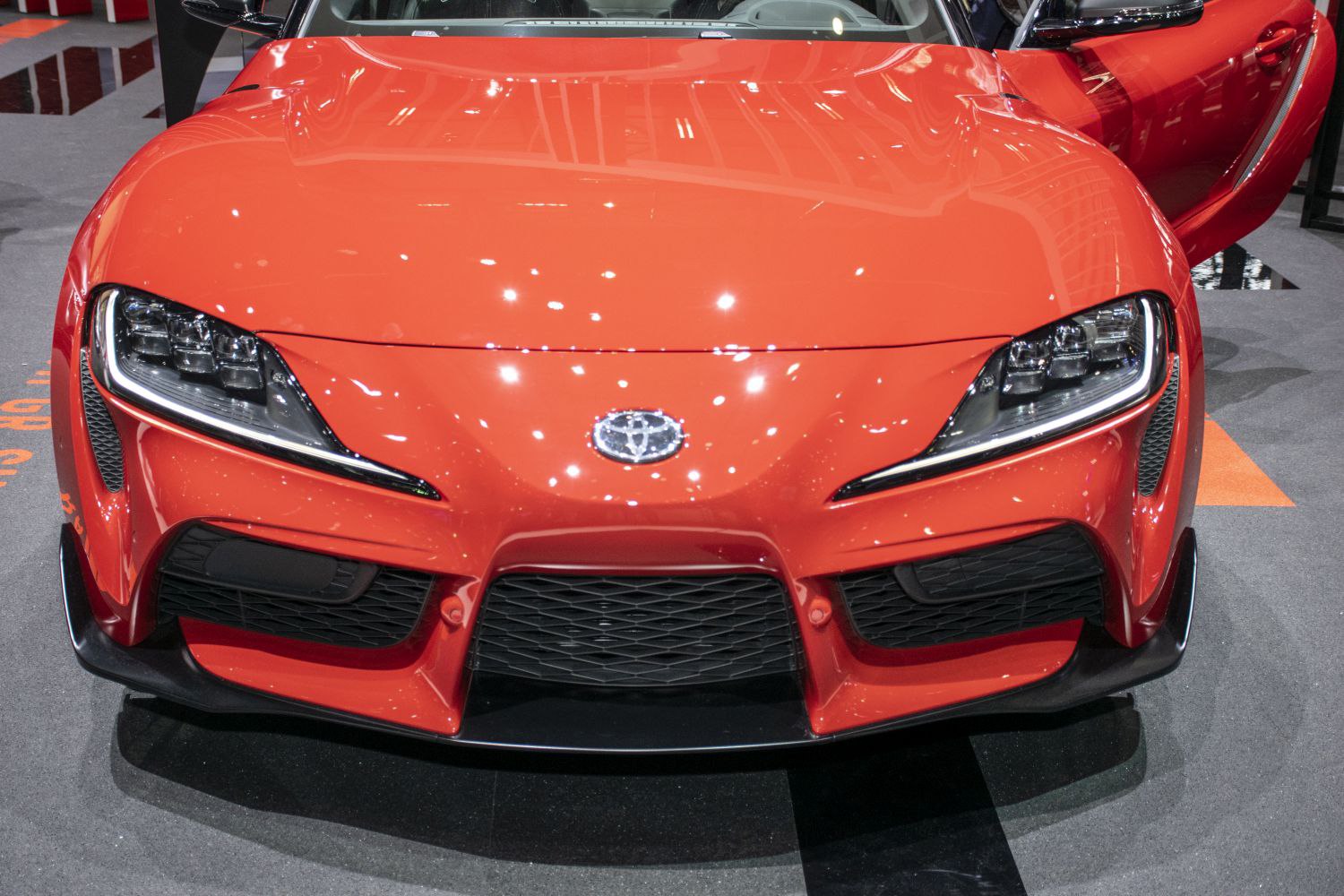 Front view with sleek headlights and aggressive bumper