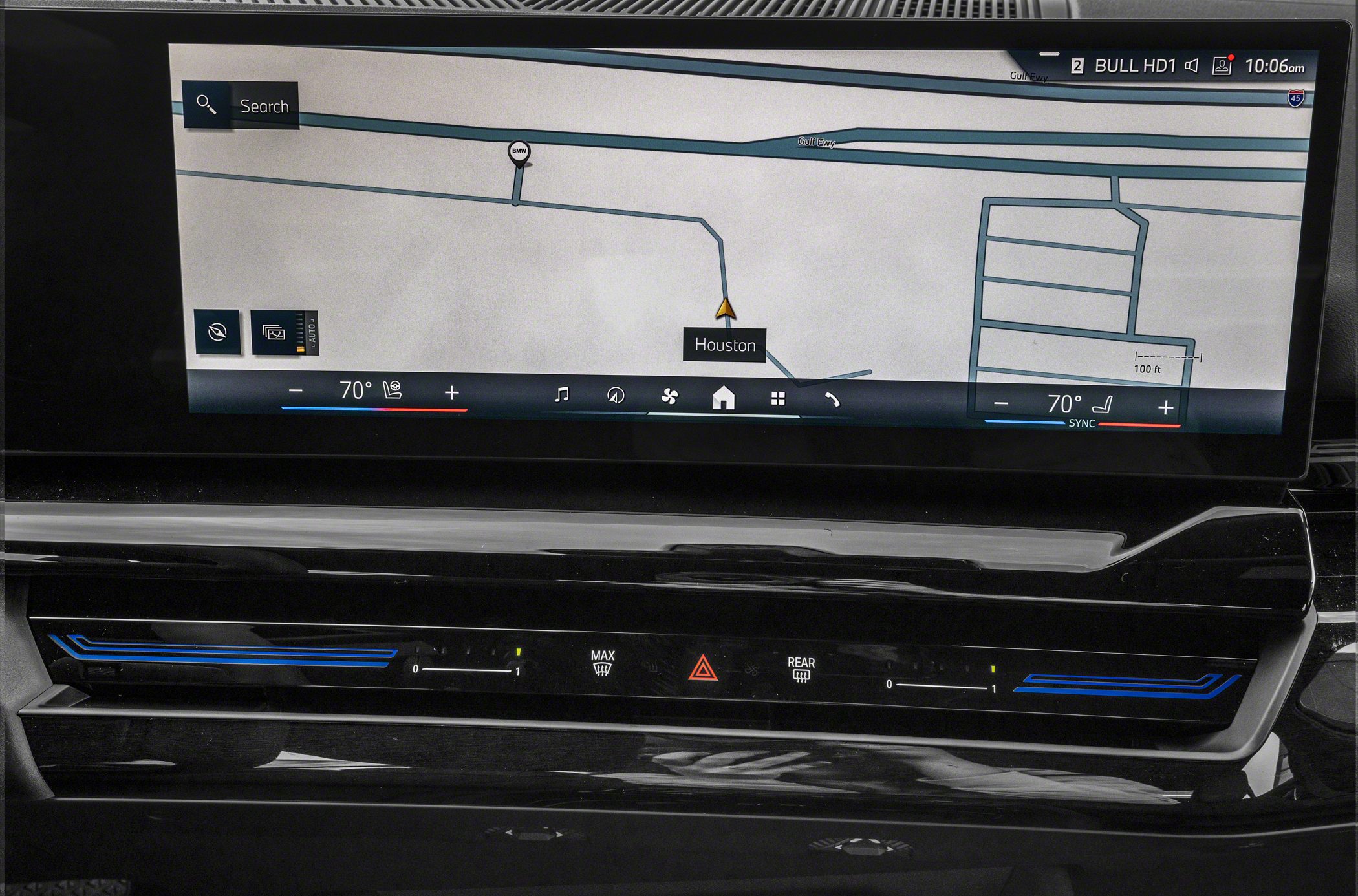 Digital touchscreen infotainment with integrated climate controls and navigation.