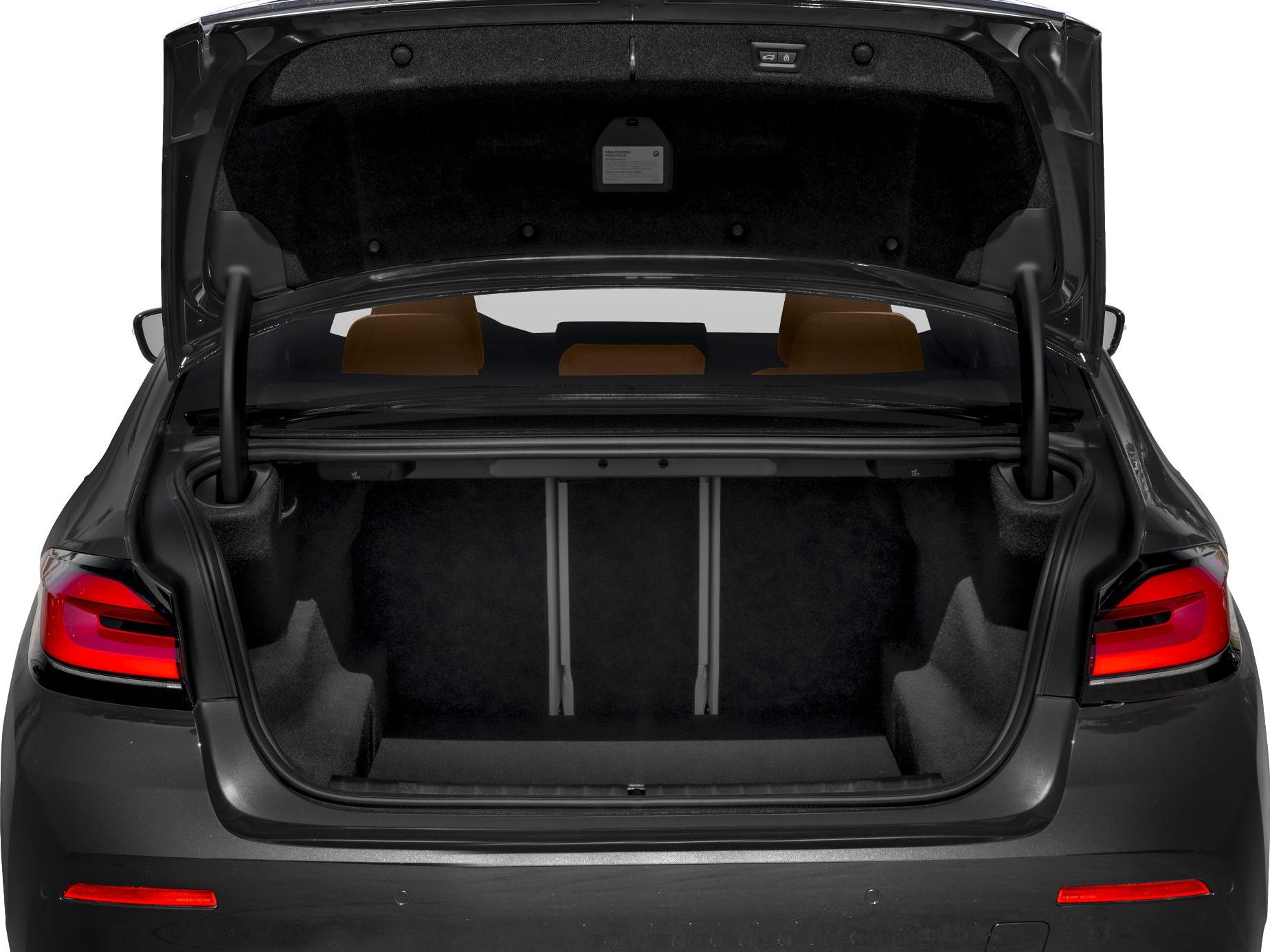 Open car trunk with spacious interior and rear seatbacks.