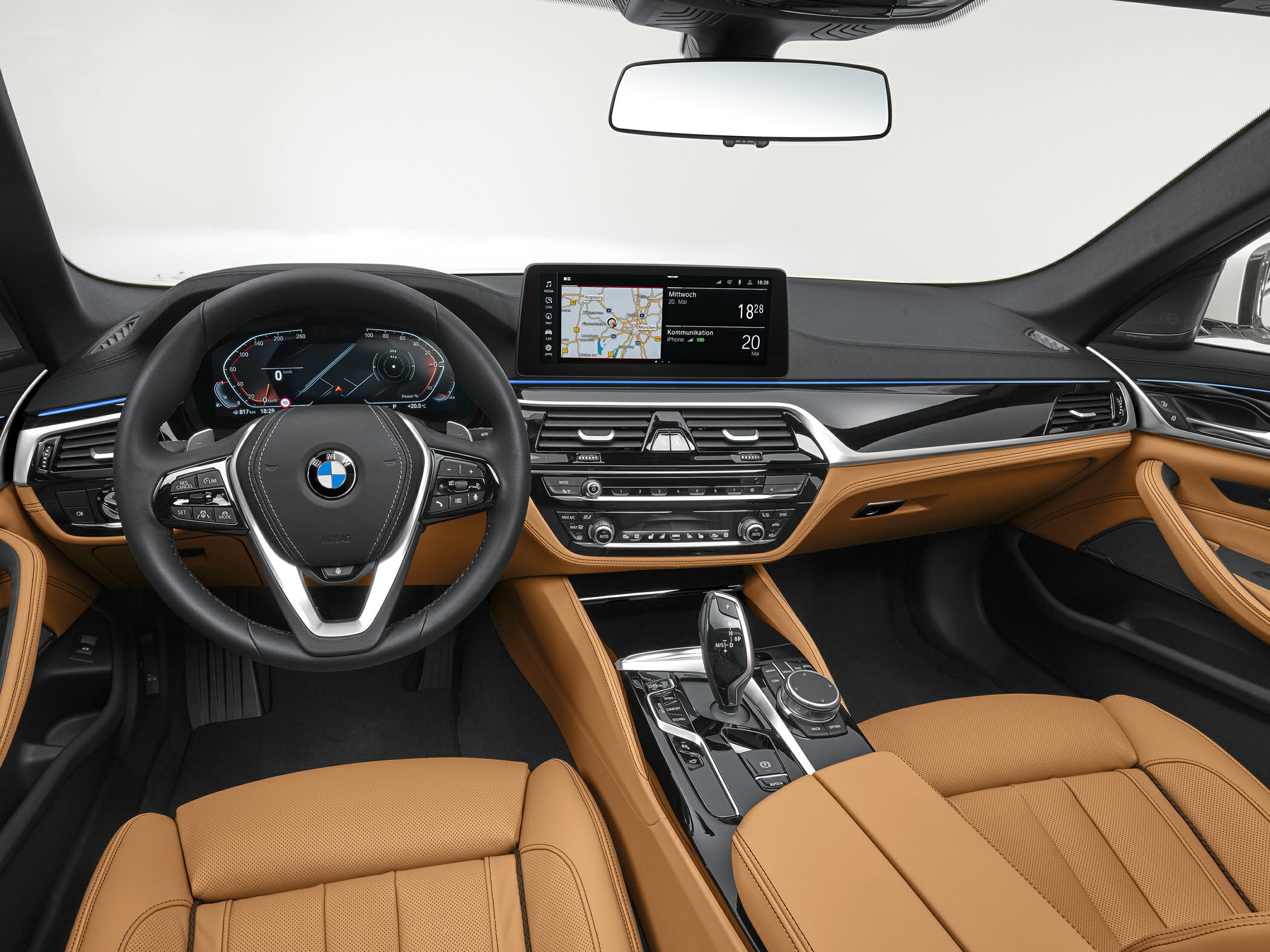 Digital dashboard, infotainment, steering wheel, tan leather interior