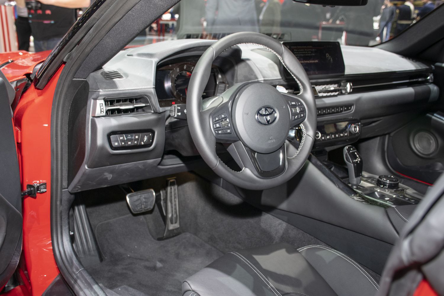 Sporty steering wheel and dashboard interior.