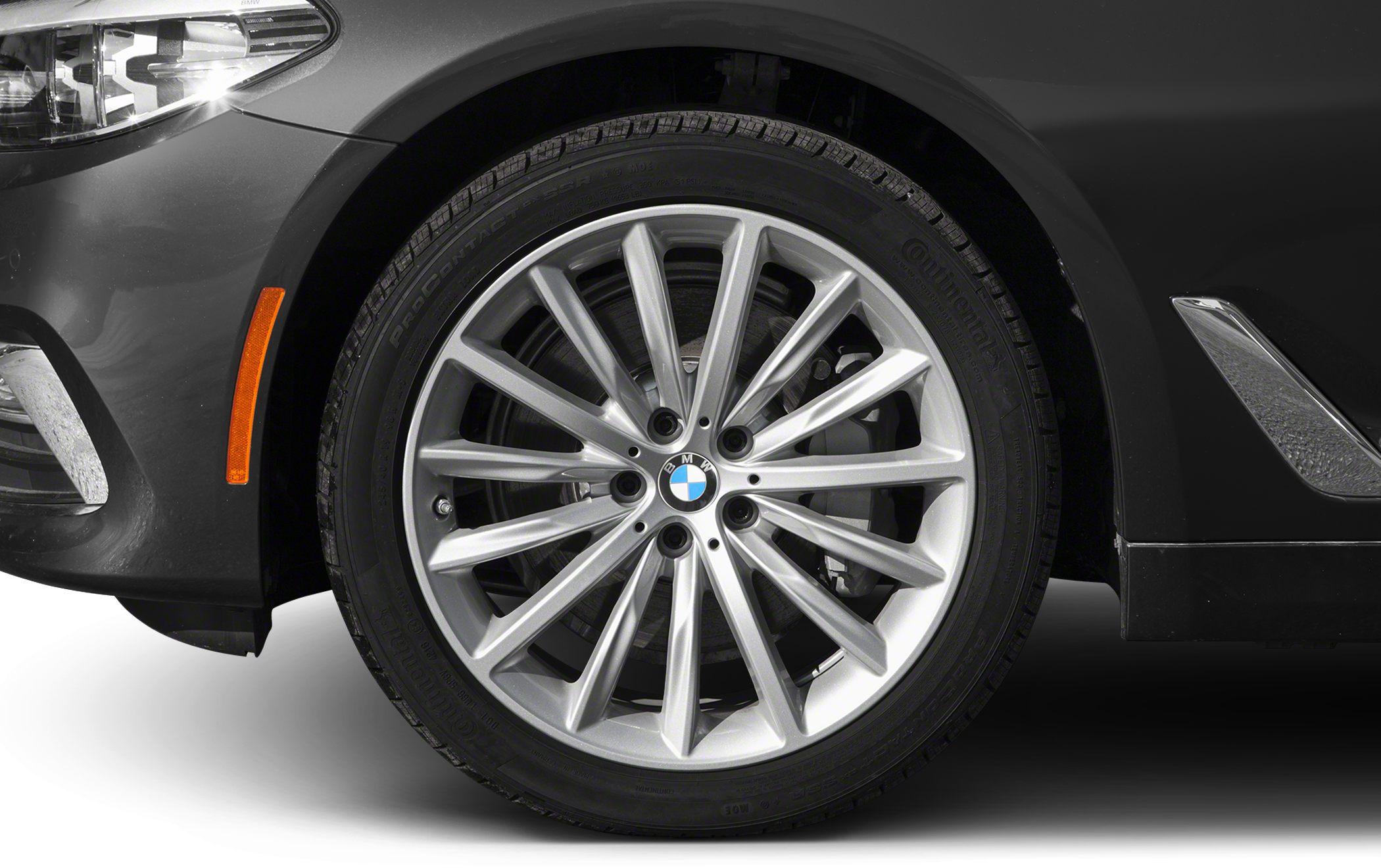 Multi-spoke alloy wheel with tire and front fender reflector