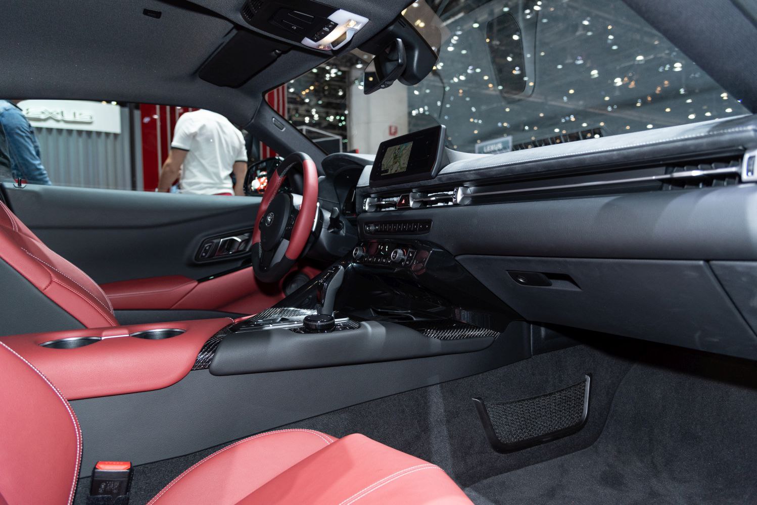 Red leather seats, sporty dashboard with infotainment screen