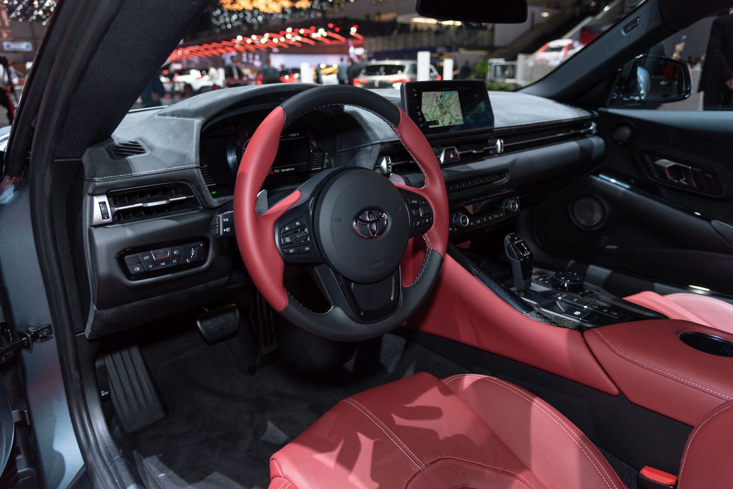 Red leather interior, digital dashboard, sporty steering wheel