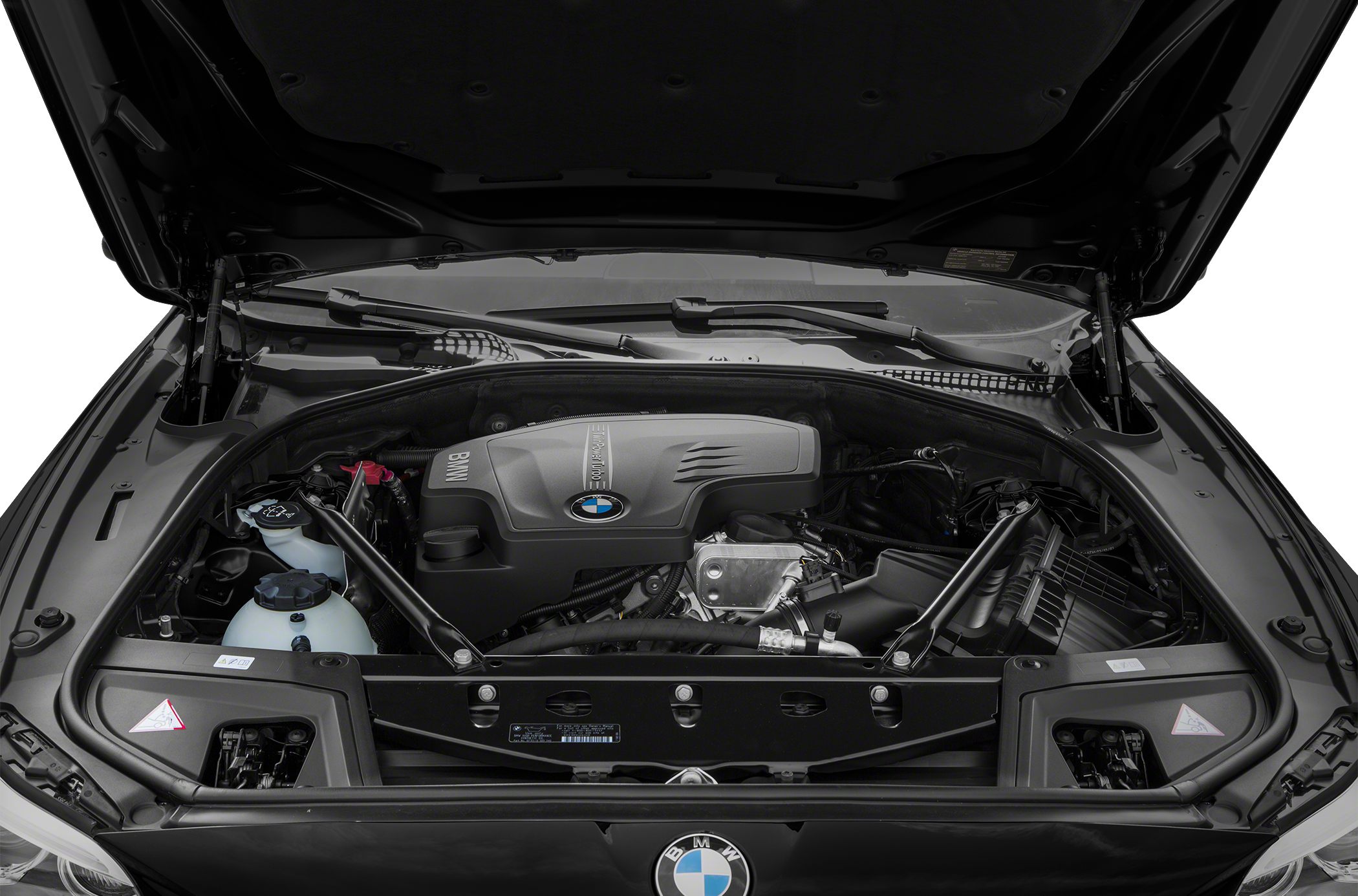 BMW inline engine with structural strut bars under hood.