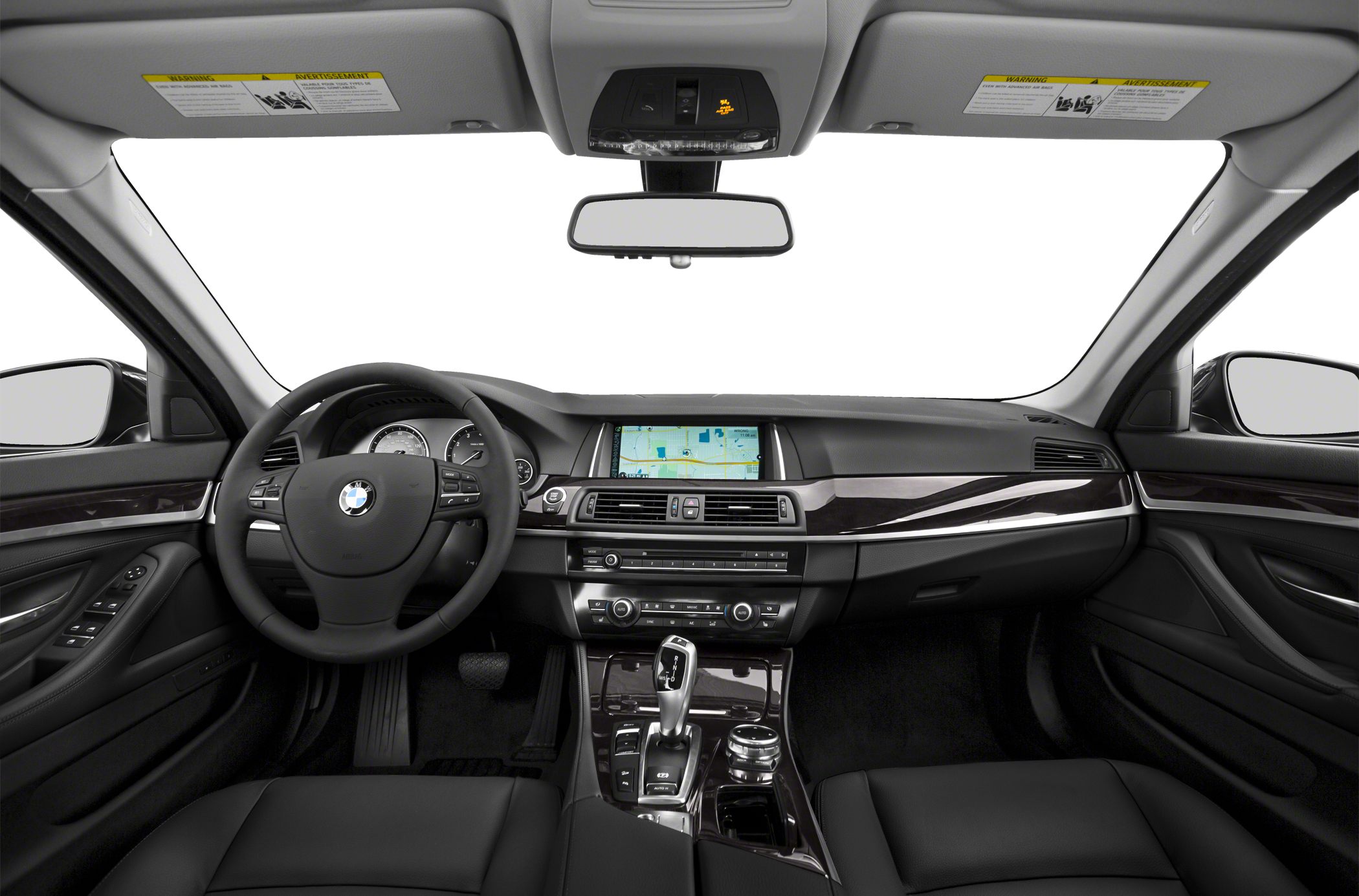 Luxury sedan interior with dashboard, steering wheel, and center console controls