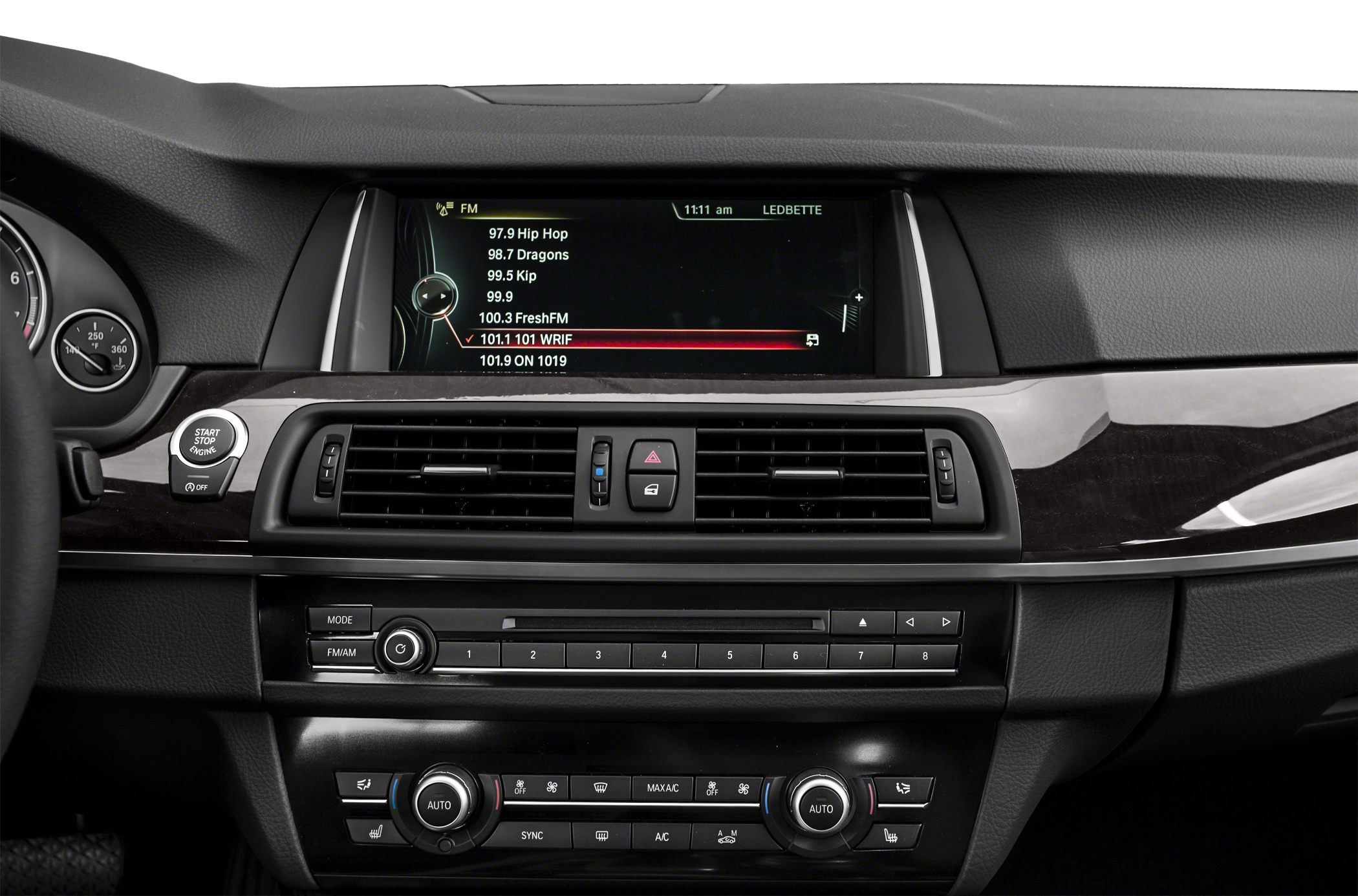 Dashboard center console with infotainment, air vents, and climate control.