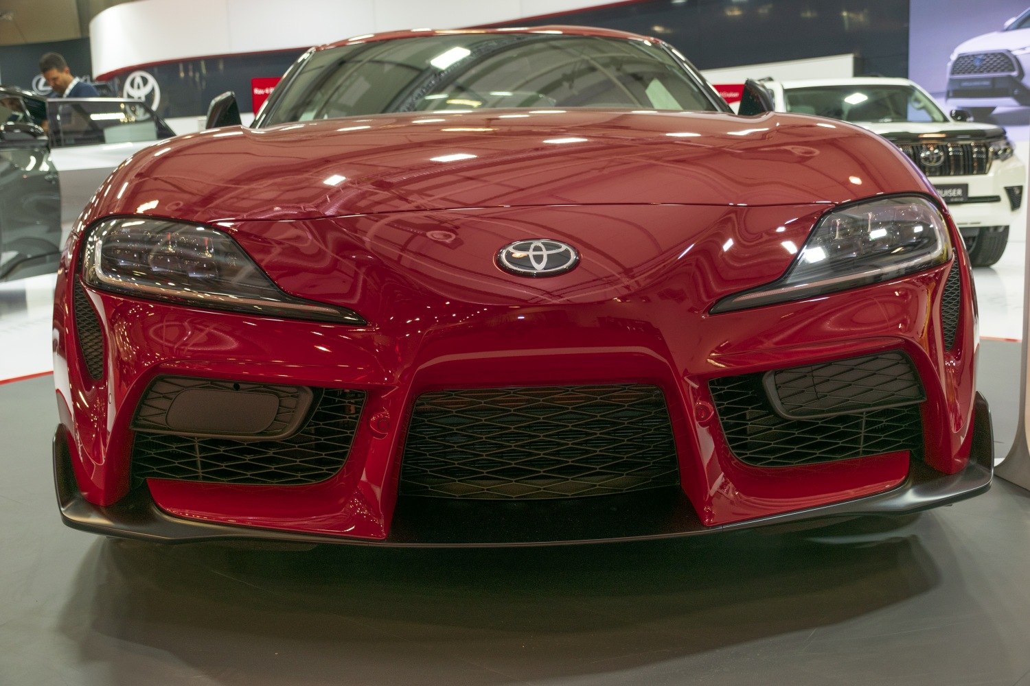 Close-up front view with sharp headlights and large central air intake