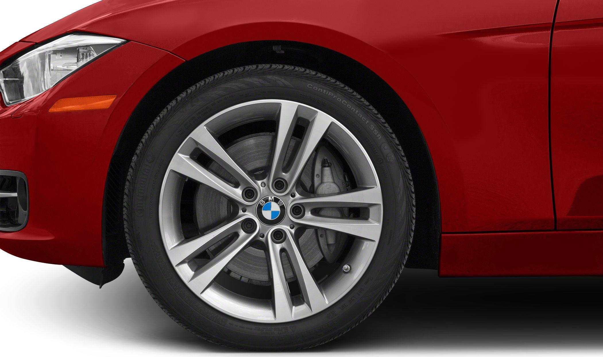 Front alloy wheel with multi-spoke design and adjacent headlight