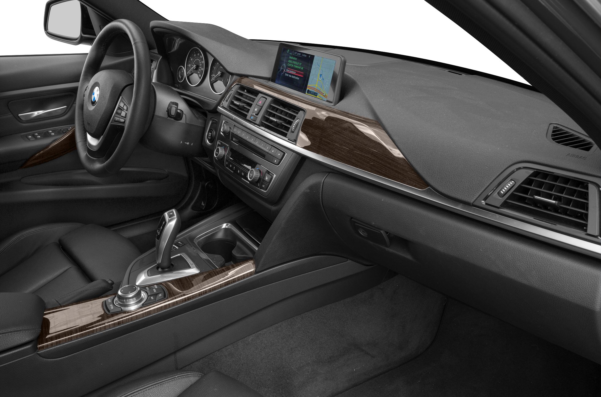 Interior with wood trim, navigation screen, and leather cockpit