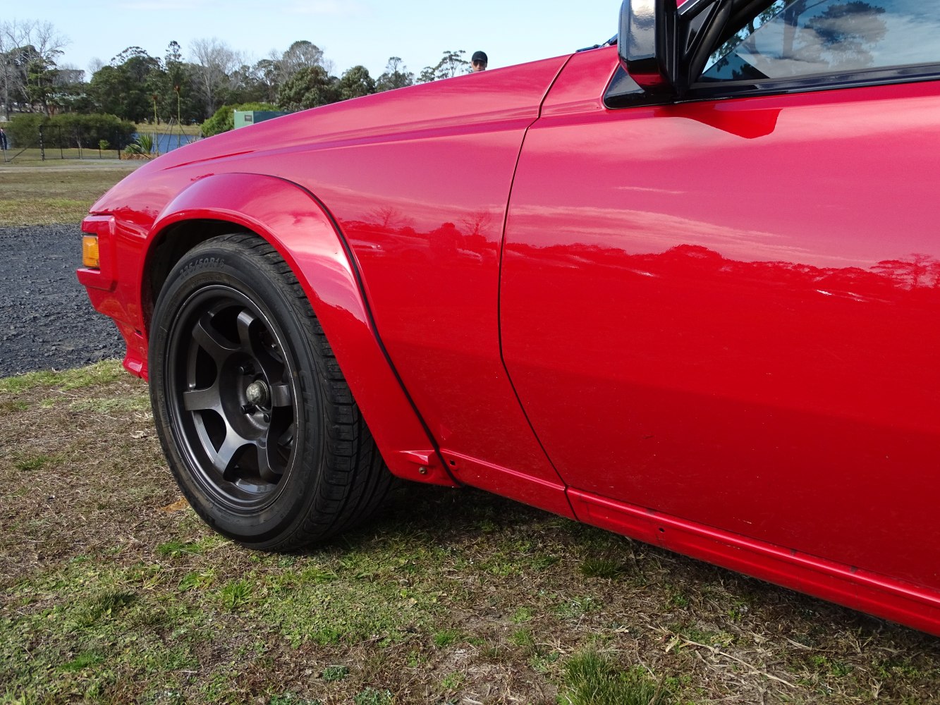 Flared front fender and black alloy wheel detail