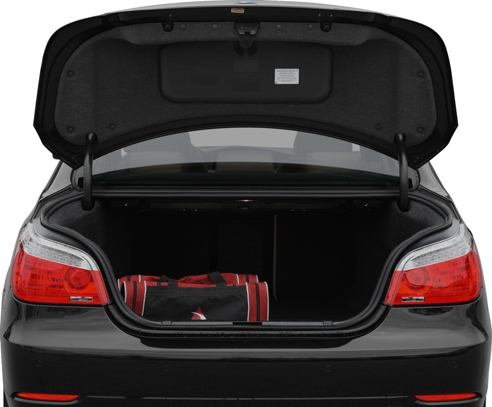 Open sedan trunk with sports bag inside