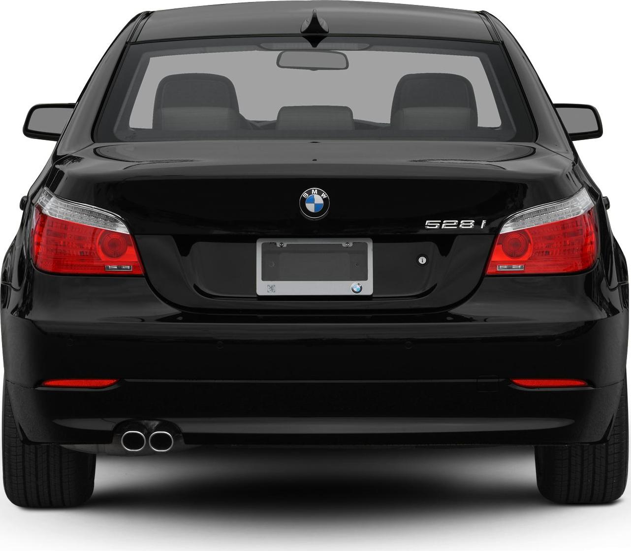 Rear view with tail lights, emblem, and dual exhaust