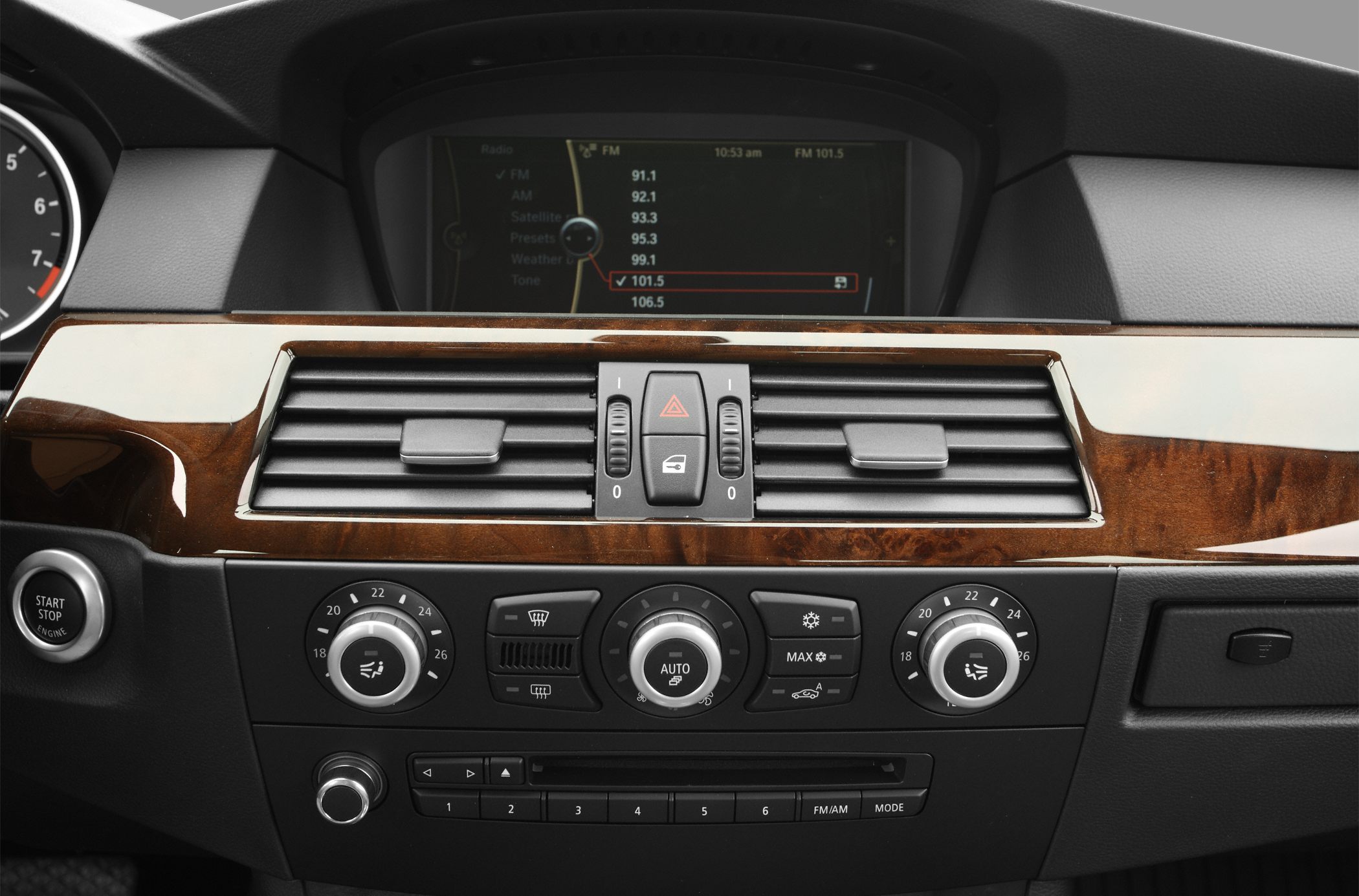 Wood trim dashboard with climate controls and infotainment screen