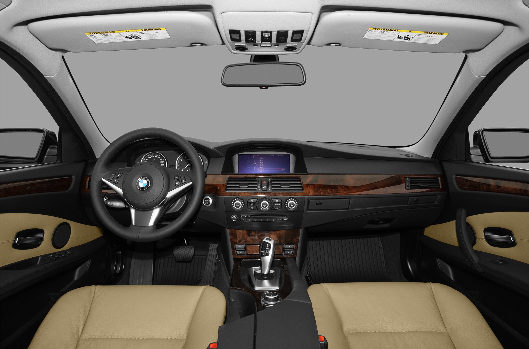 Luxury car interior with wood trim and navigation display