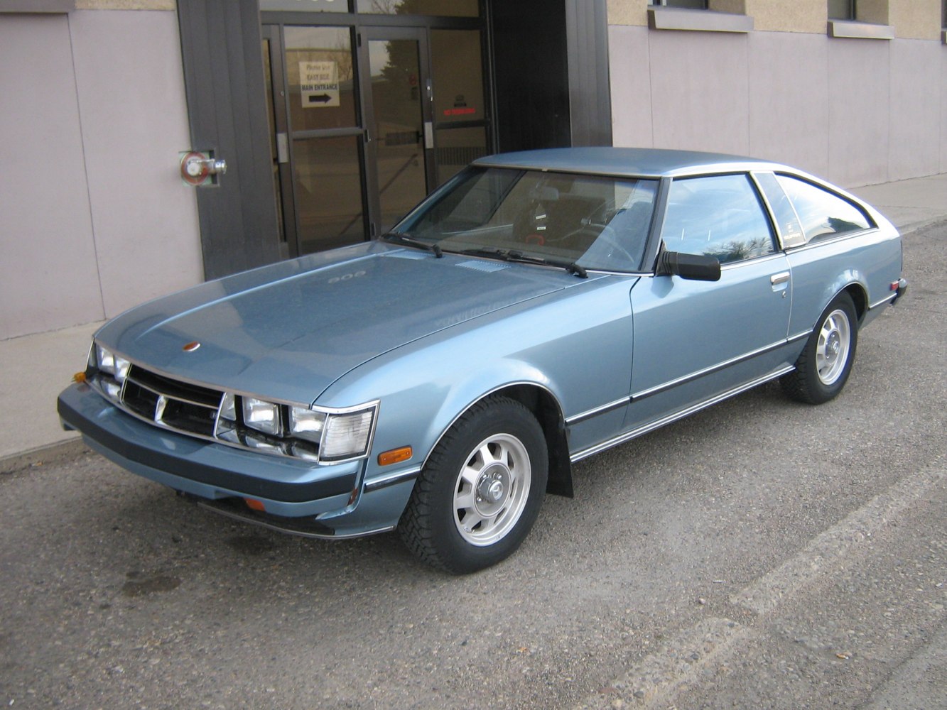 Classic 1970s front grille and angular side profile of a two-door coupe