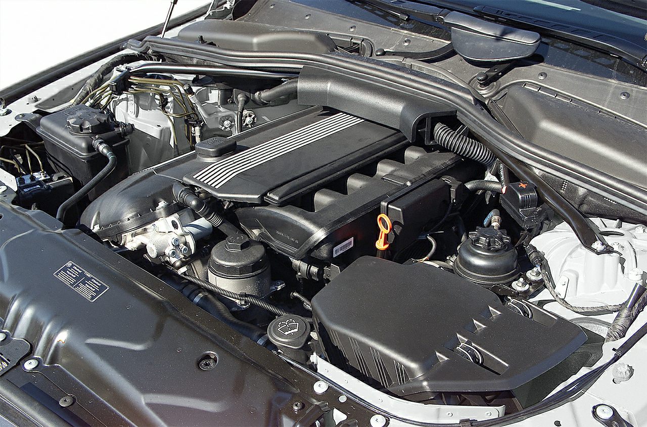 Engine compartment with air intake, oil cap, dipstick in motor bay