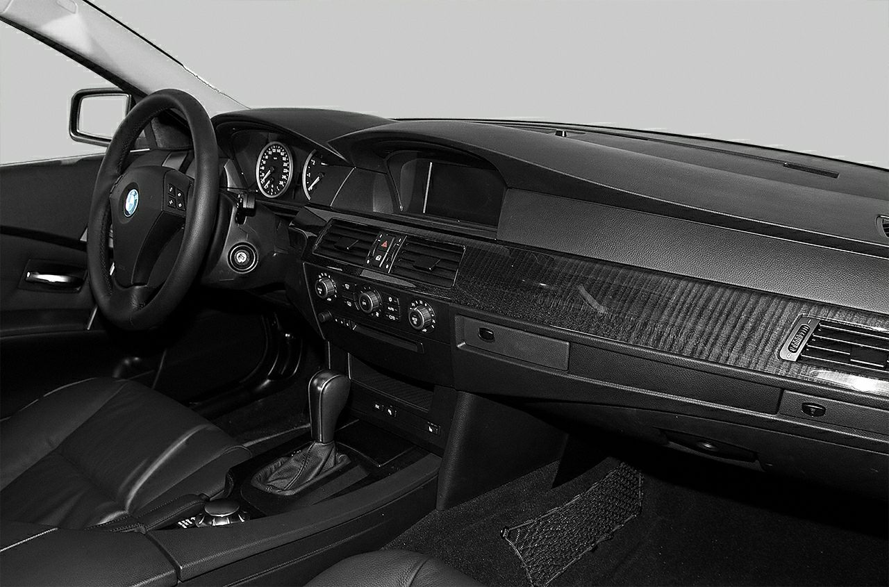 Interior dashboard and steering wheel with automatic gear shift and leather seats